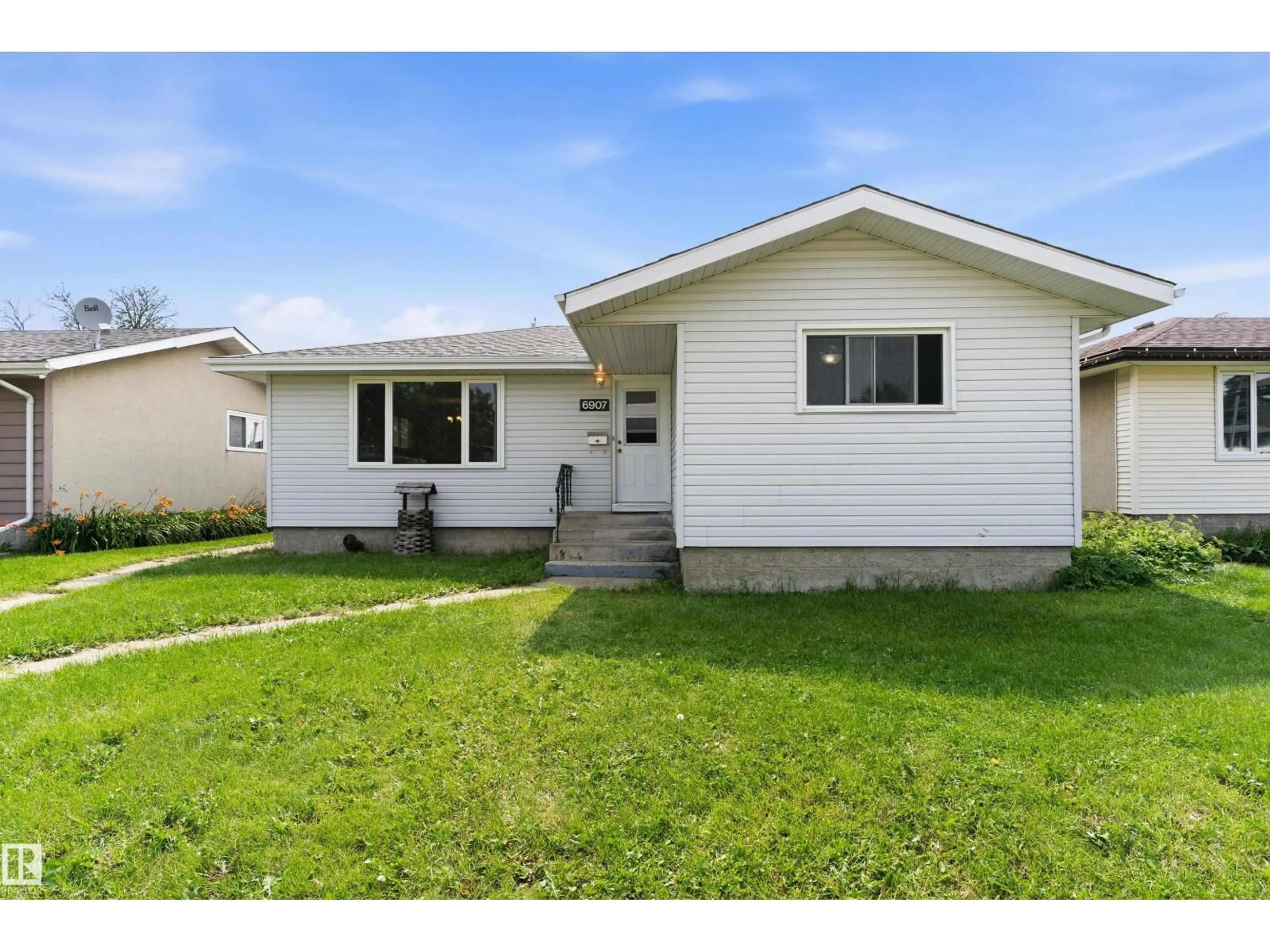 Home with vinyl exterior material, street for 6907 DELWOOD RD, Edmonton Alberta T5C3A6