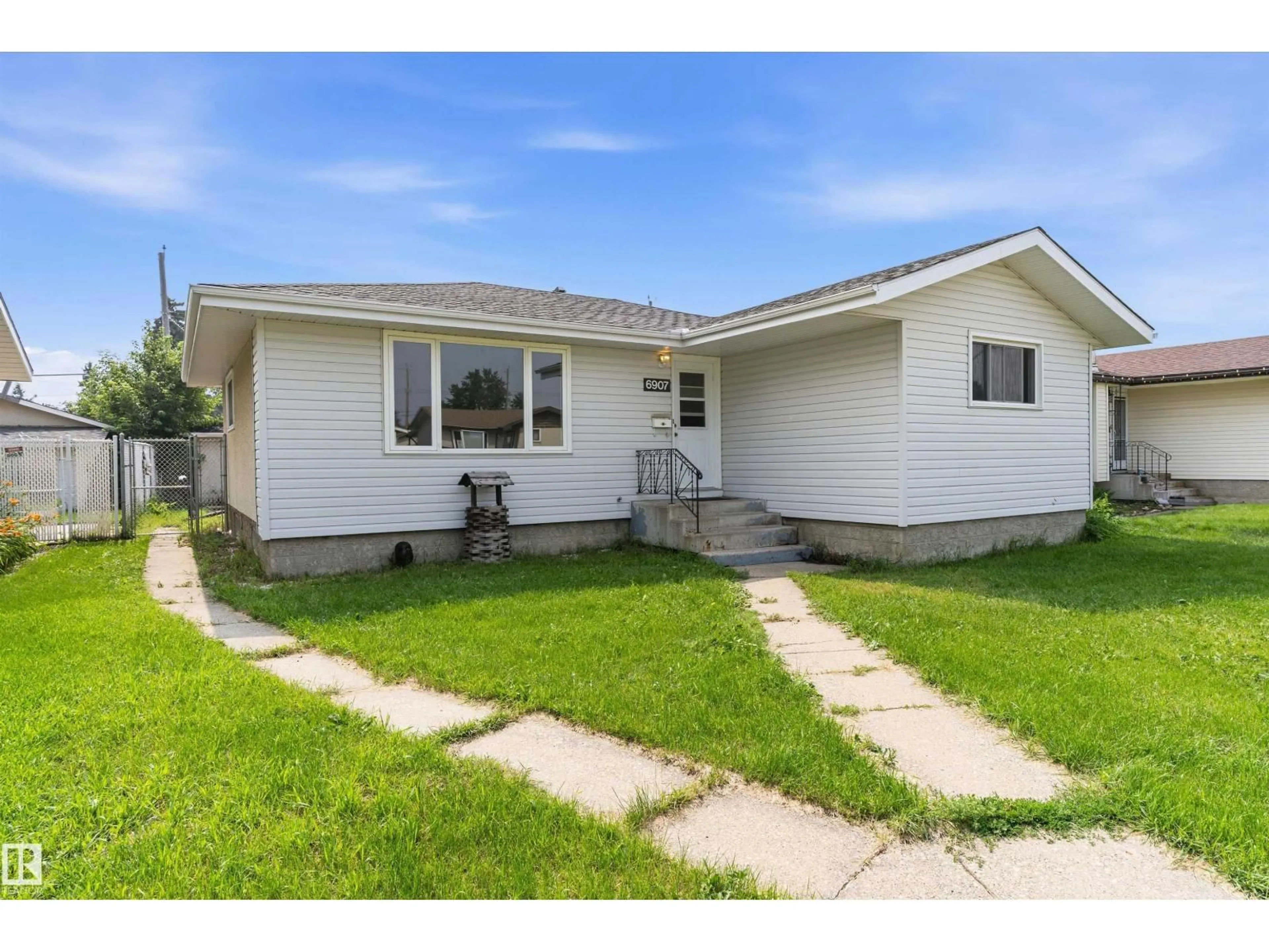 Home with vinyl exterior material, street for 6907 DELWOOD RD, Edmonton Alberta T5C3A6