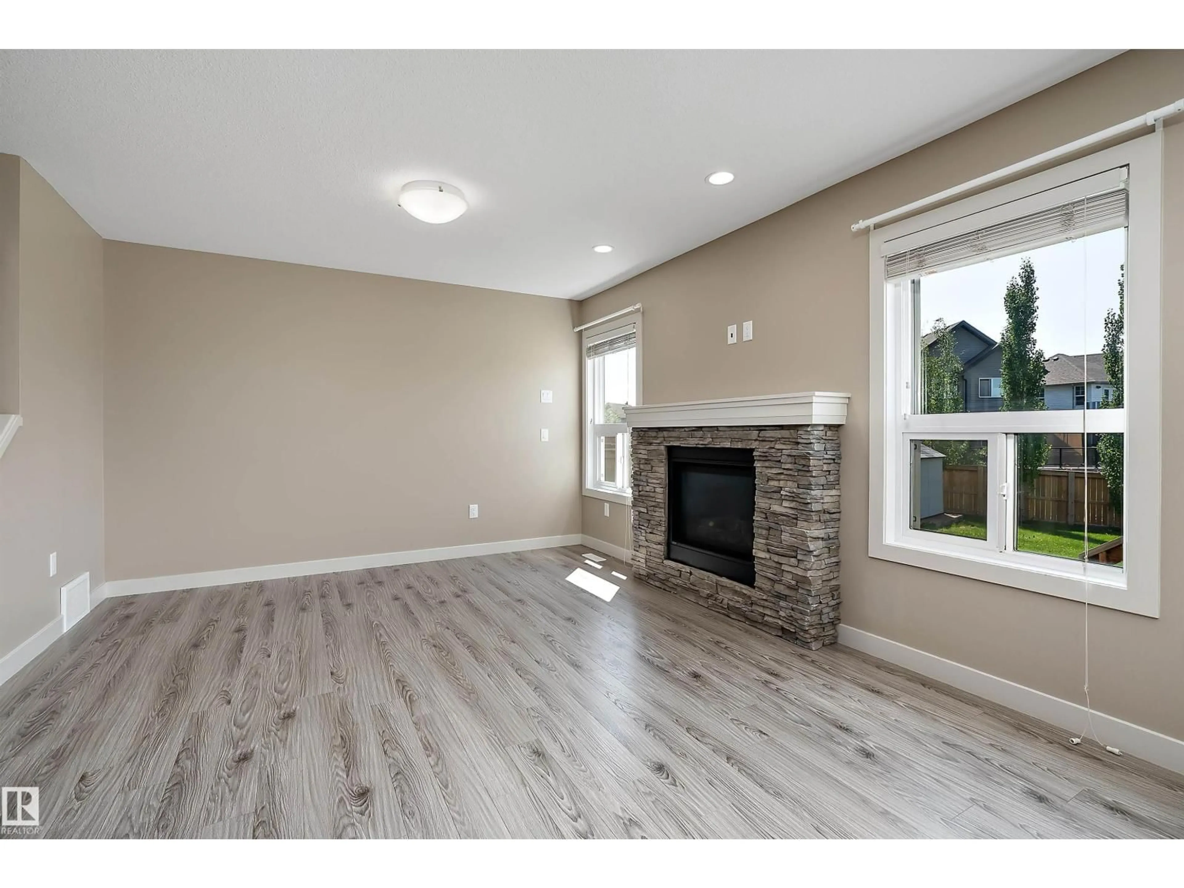 Living room with furniture, wood/laminate floor for 217 SUNPINE POINTE, Sherwood Park Alberta T8H0Z6