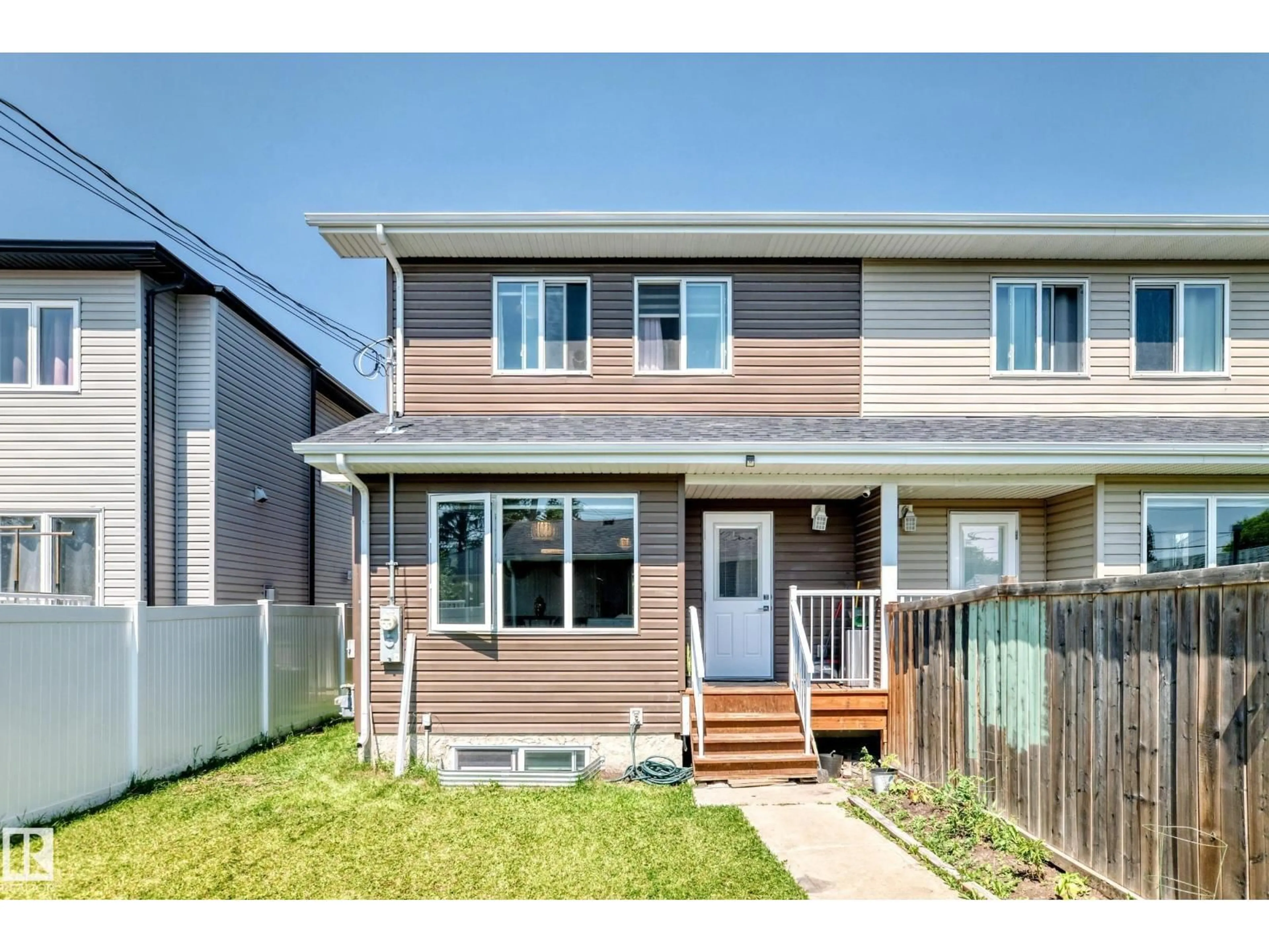 Home with vinyl exterior material, street for 15503 95 AV, Edmonton Alberta T5P0A2