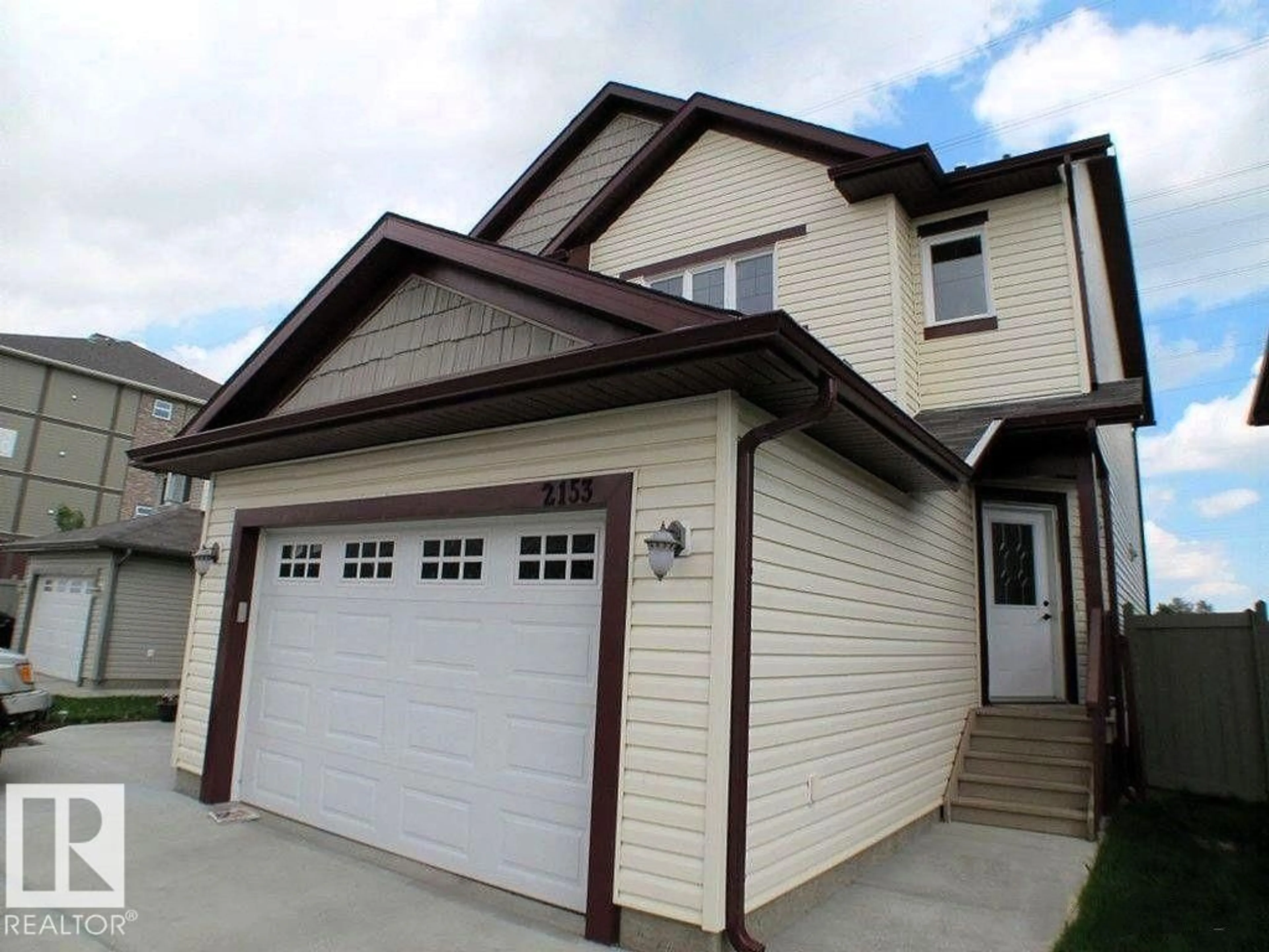 Home with vinyl exterior material, street for NW - 2153 28 ST, Edmonton Alberta T6T0K1