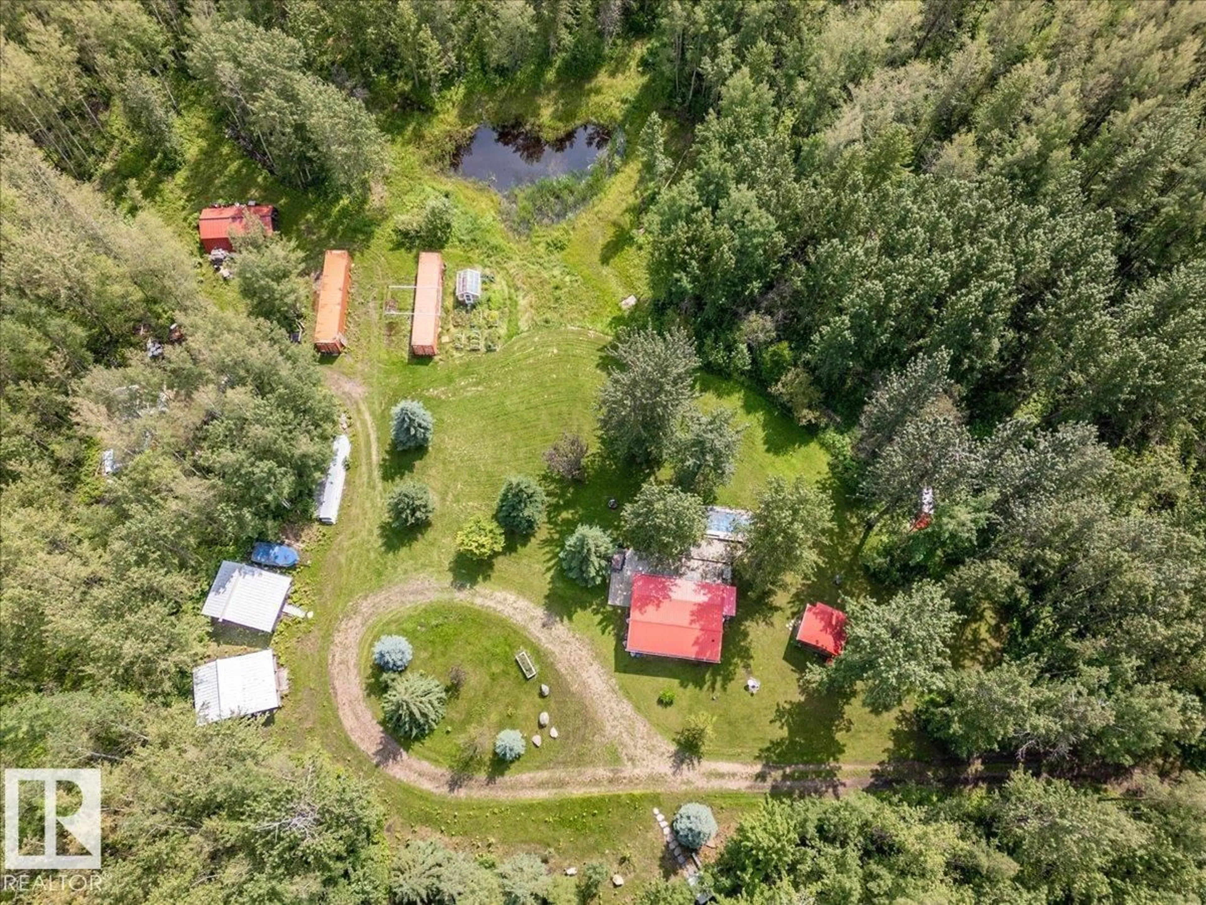 A pic from outside/outdoor area/front of a property/back of a property/a pic from drone, forest/trees view for 1301 GLEN HAVEN CR, Rural Wetaskiwin County Alberta T0C2C0