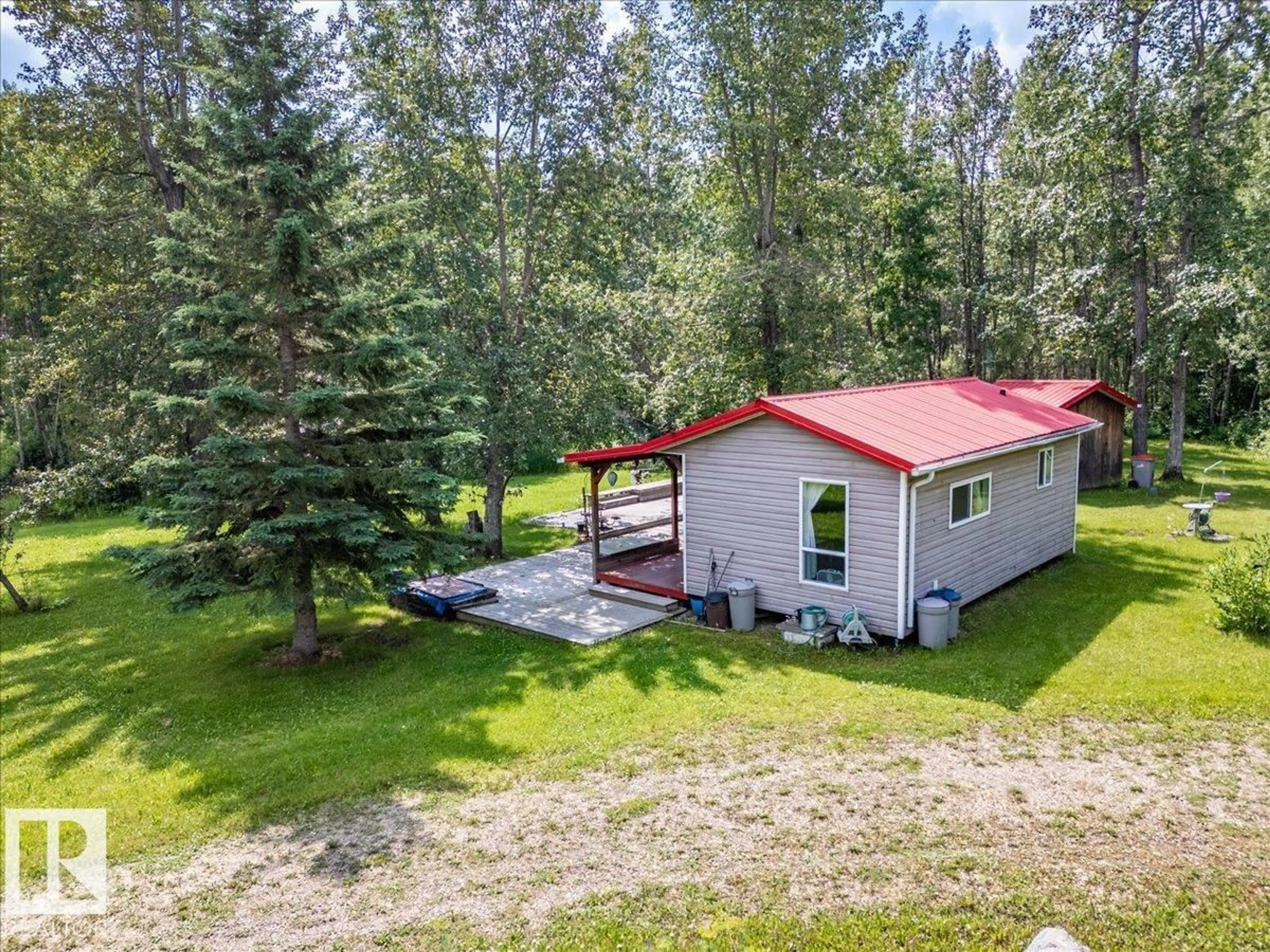 A pic from outside/outdoor area/front of a property/back of a property/a pic from drone, forest/trees view for 1301 GLEN HAVEN CR, Rural Wetaskiwin County Alberta T0C2C0