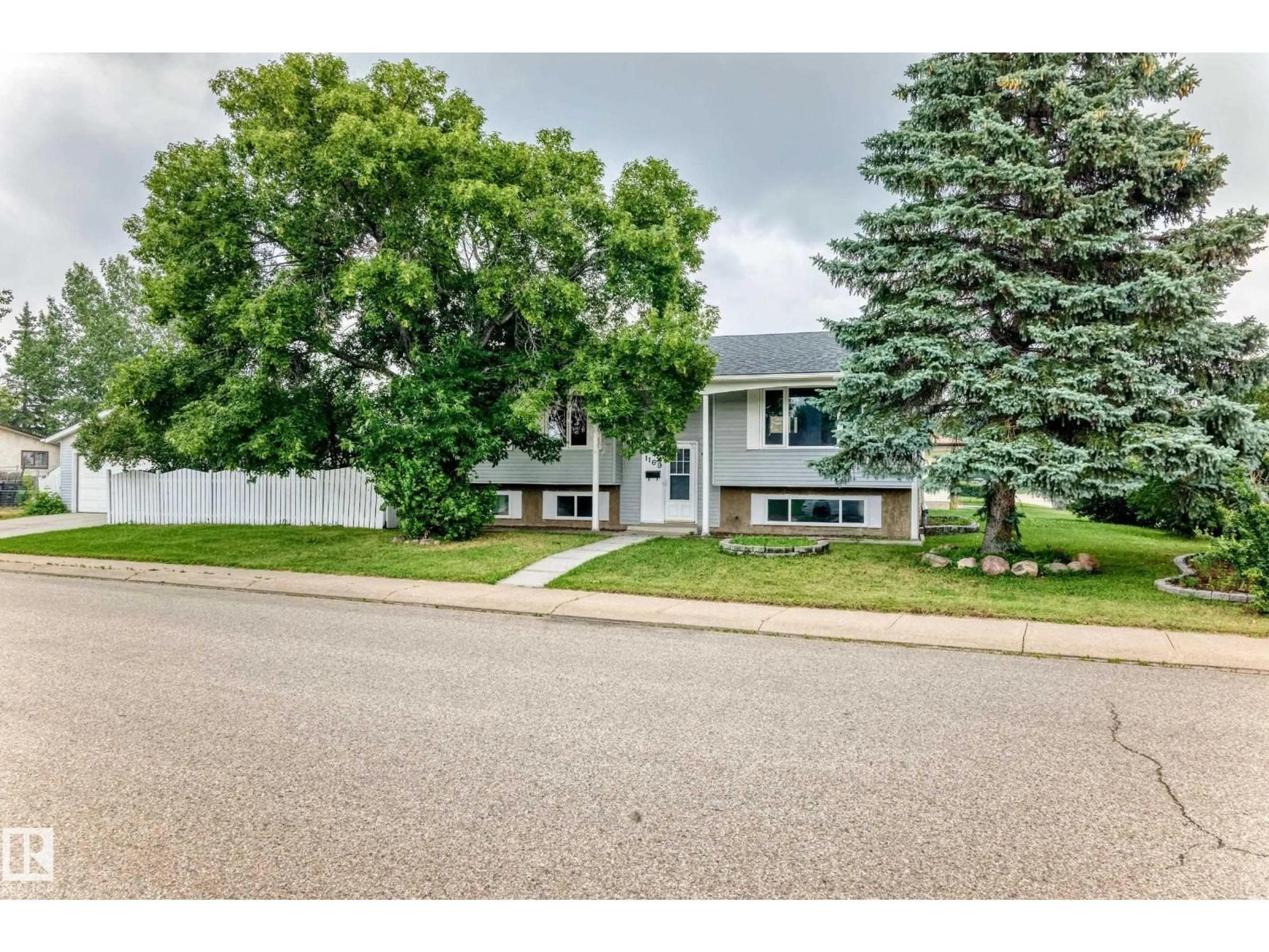 Home with vinyl exterior material, street for 1169 72 ST, Edmonton Alberta T6K3L7