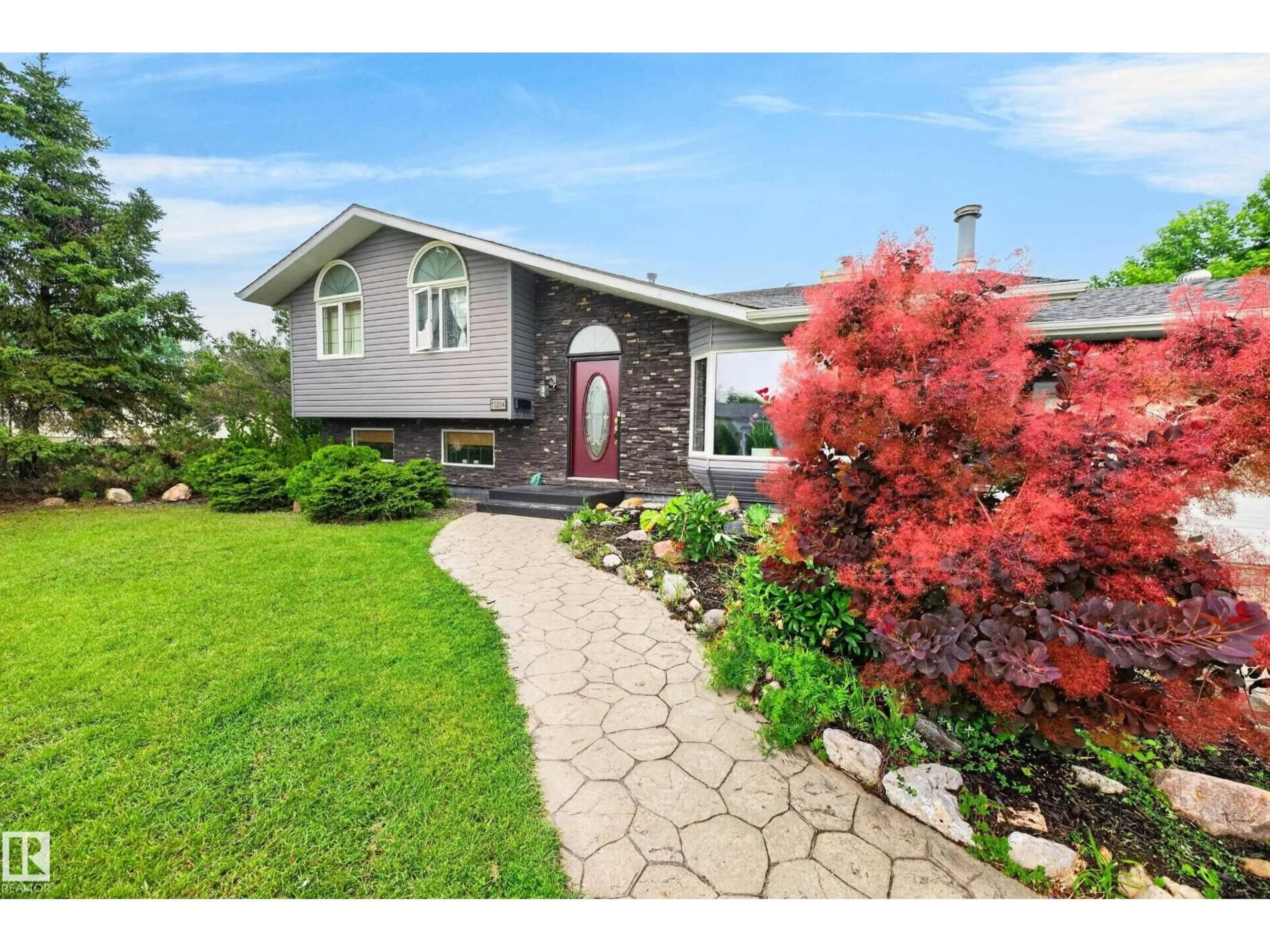 Home with vinyl exterior material, street for NW - 13204 47 ST, Edmonton Alberta T5A3P6