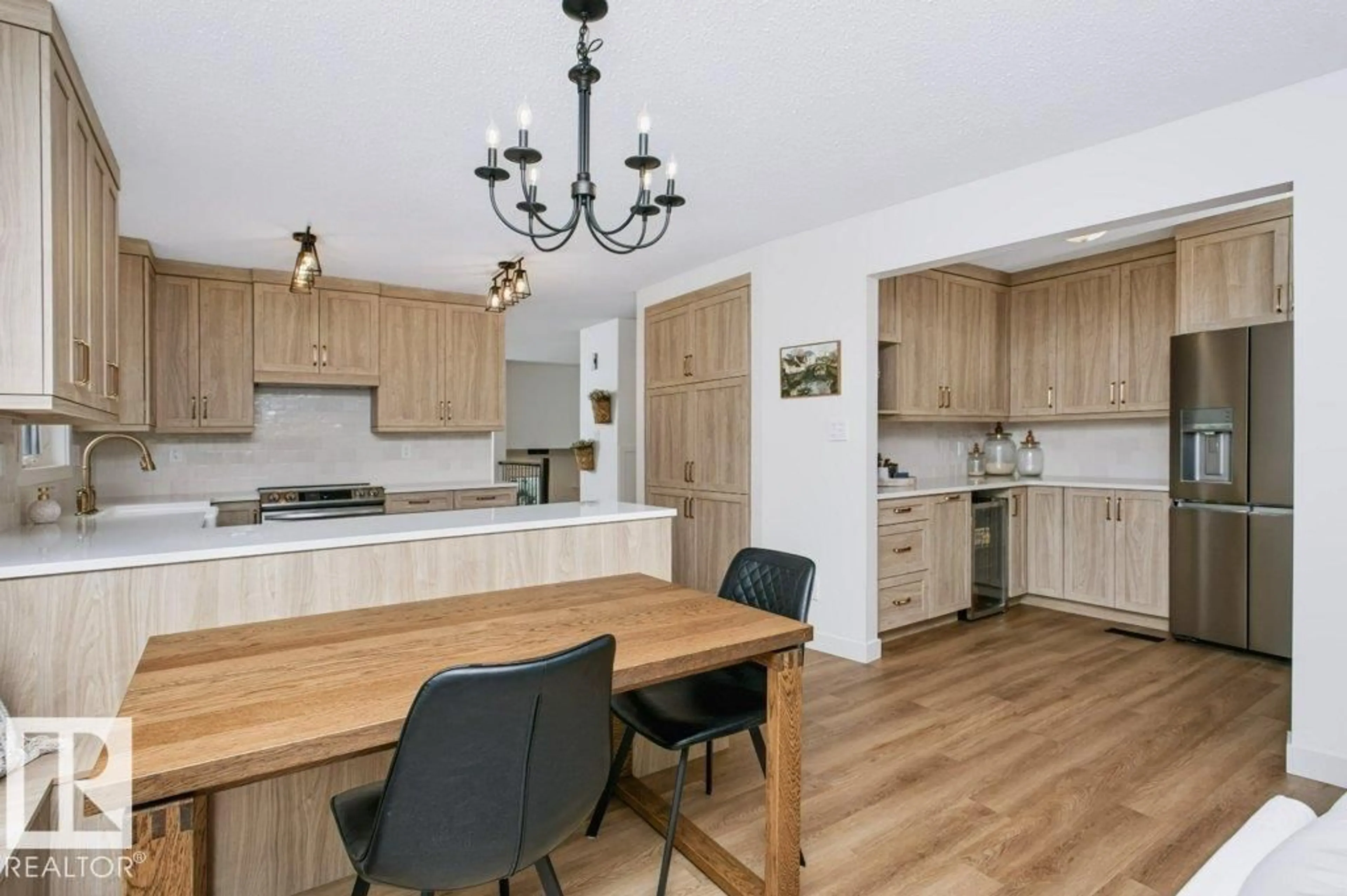 Open concept kitchen, wood/laminate floor for 43 HILLSIDE CR, Sherwood Park Alberta T8A5E2