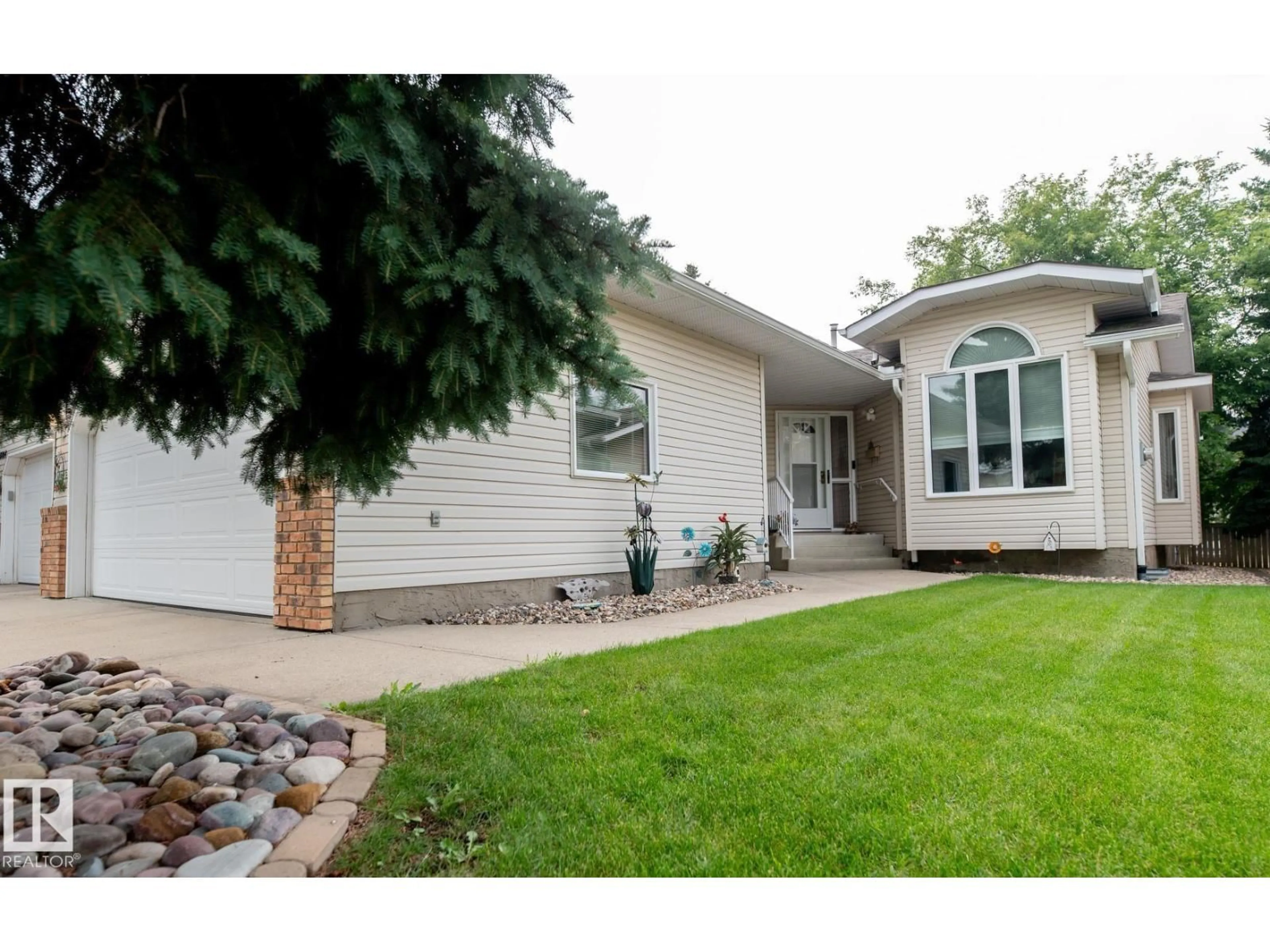 Home with vinyl exterior material, street for 10860 25 AV, Edmonton Alberta T6J6N5