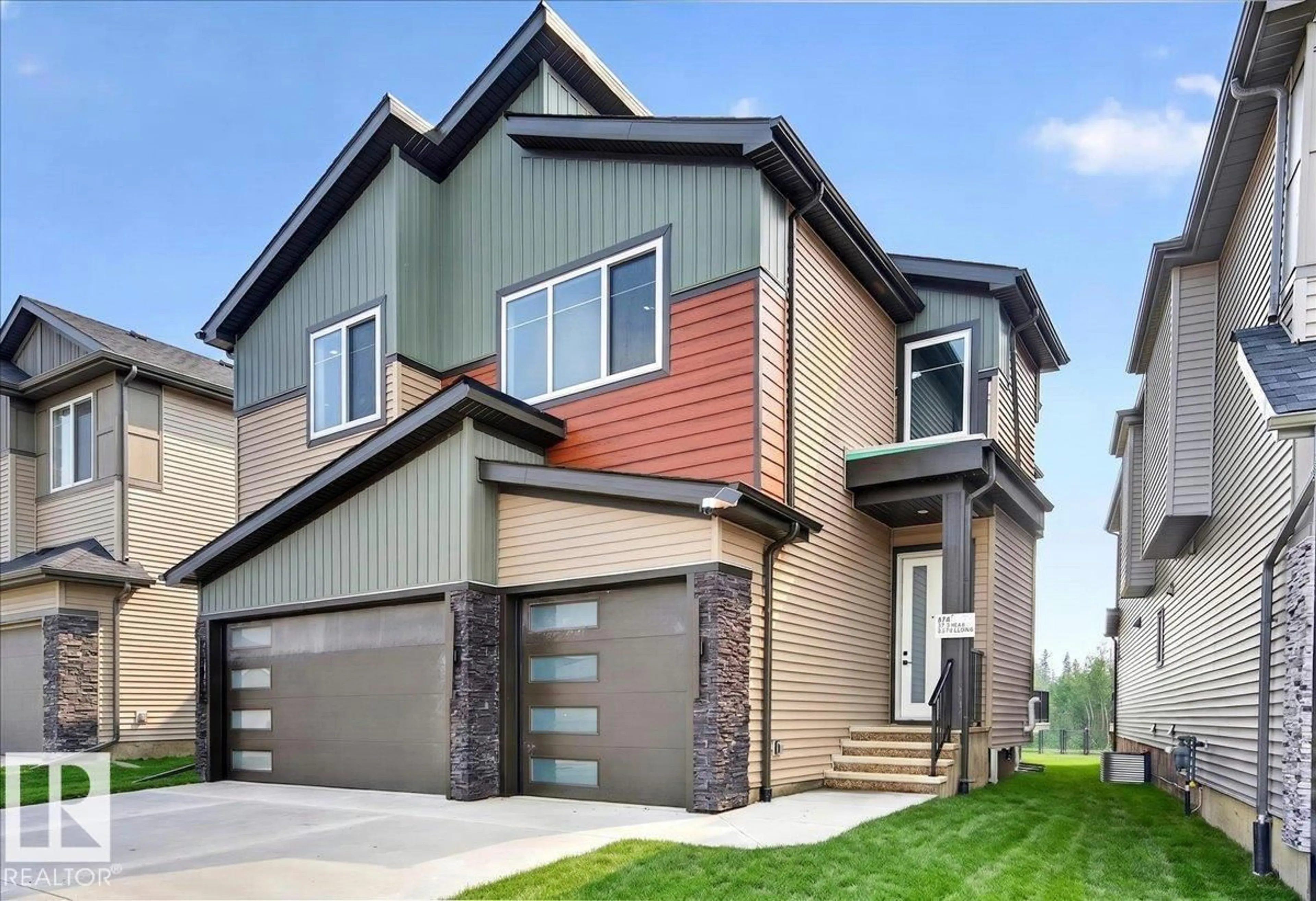 Home with vinyl exterior material, street for 403 172 AV, Edmonton Alberta T5Y4K9