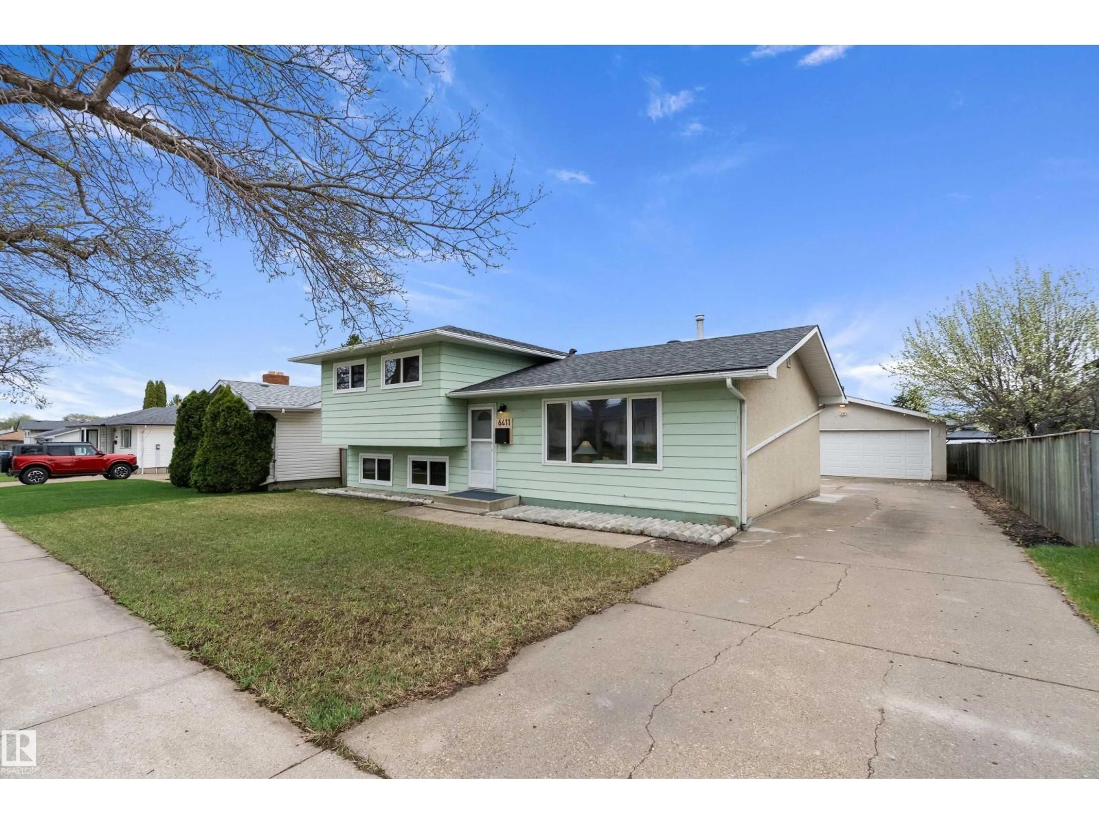Home with vinyl exterior material, street for 6411 152A AV, Edmonton Alberta T5A1X9