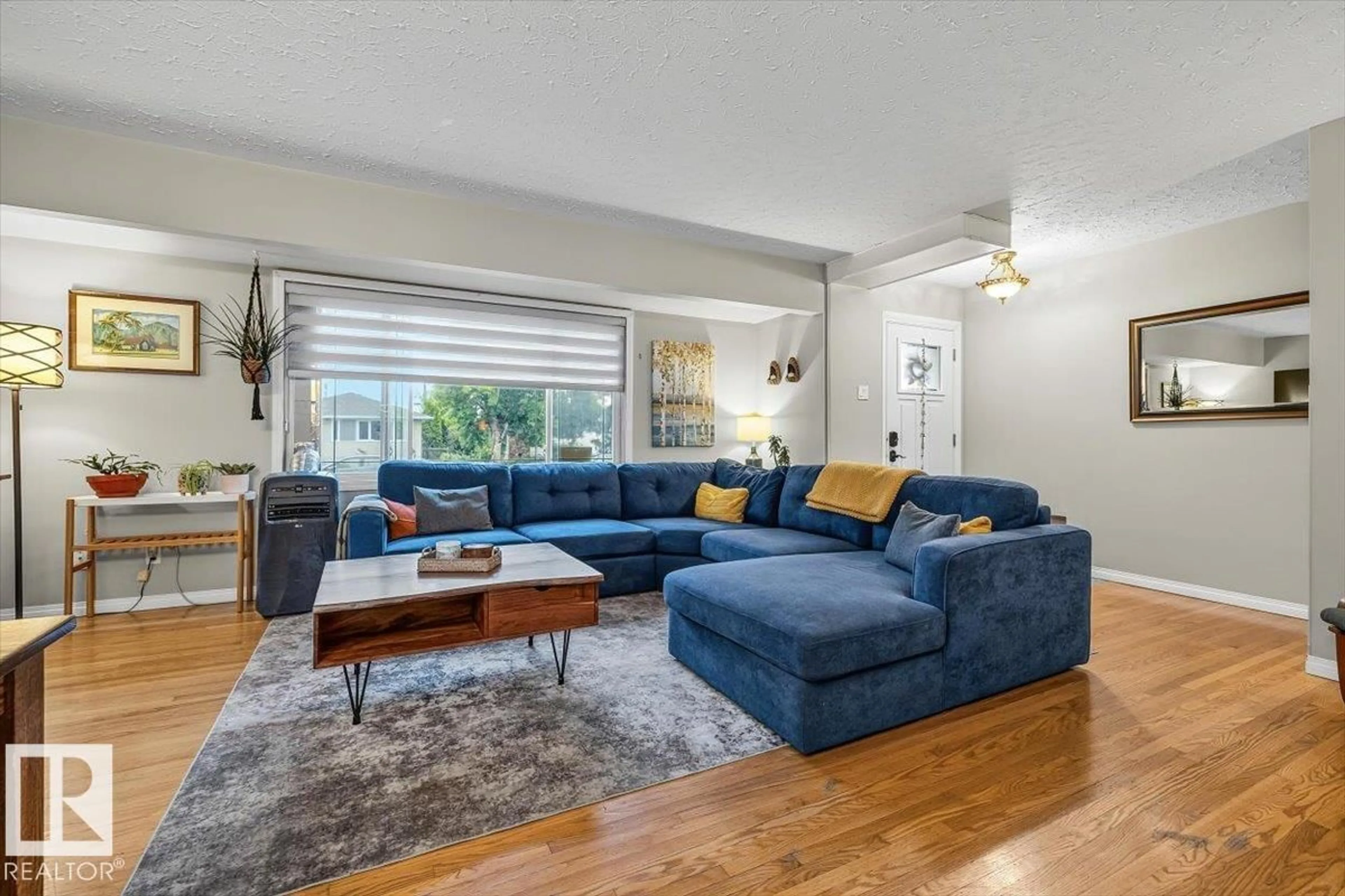 Living room with furniture, unknown for 5903 102 AV NW, Edmonton Alberta T6A0N3