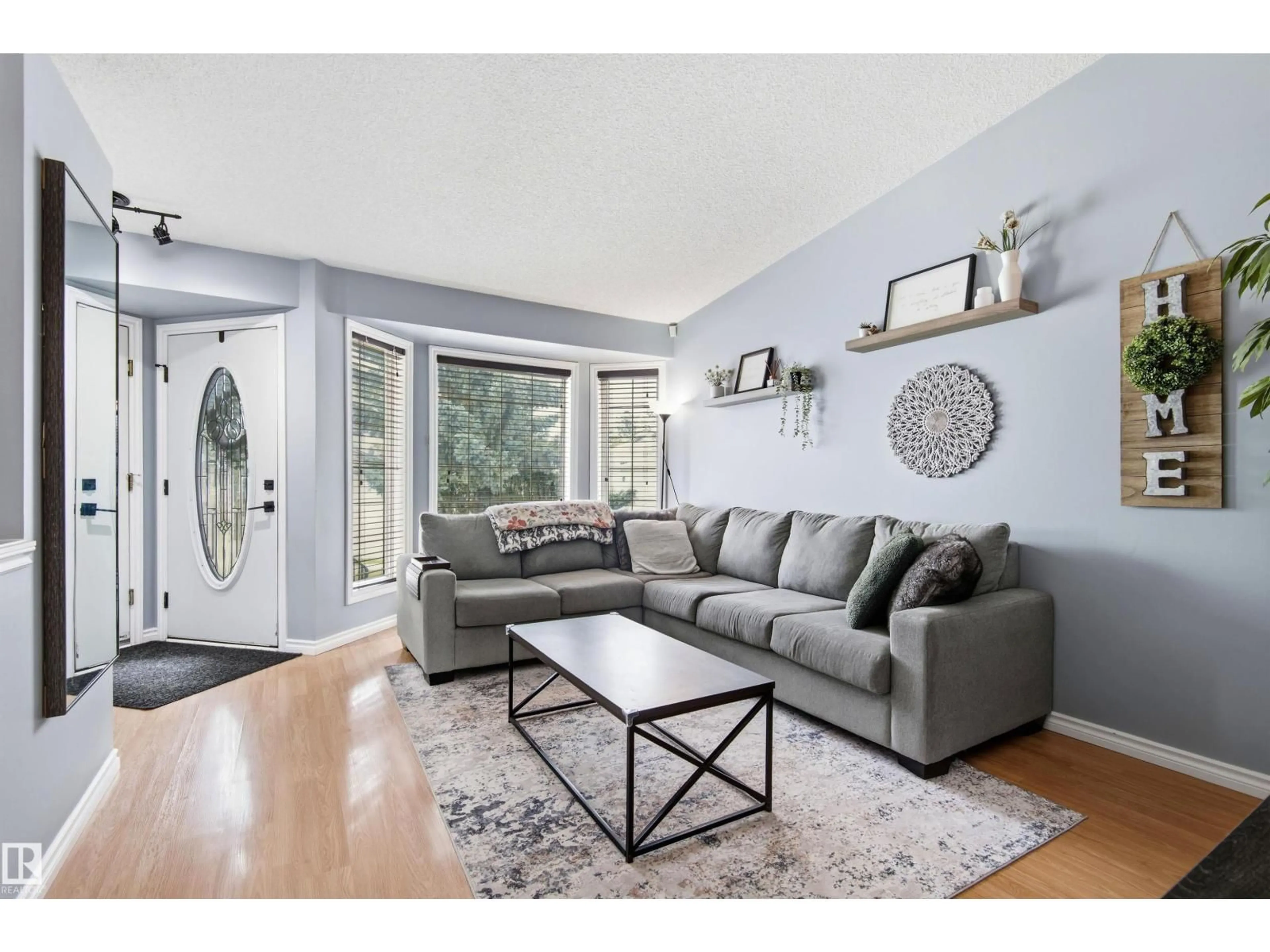 Living room with furniture, wood/laminate floor for 257 RAINBOW CR, Sherwood Park Alberta T8A5Y1