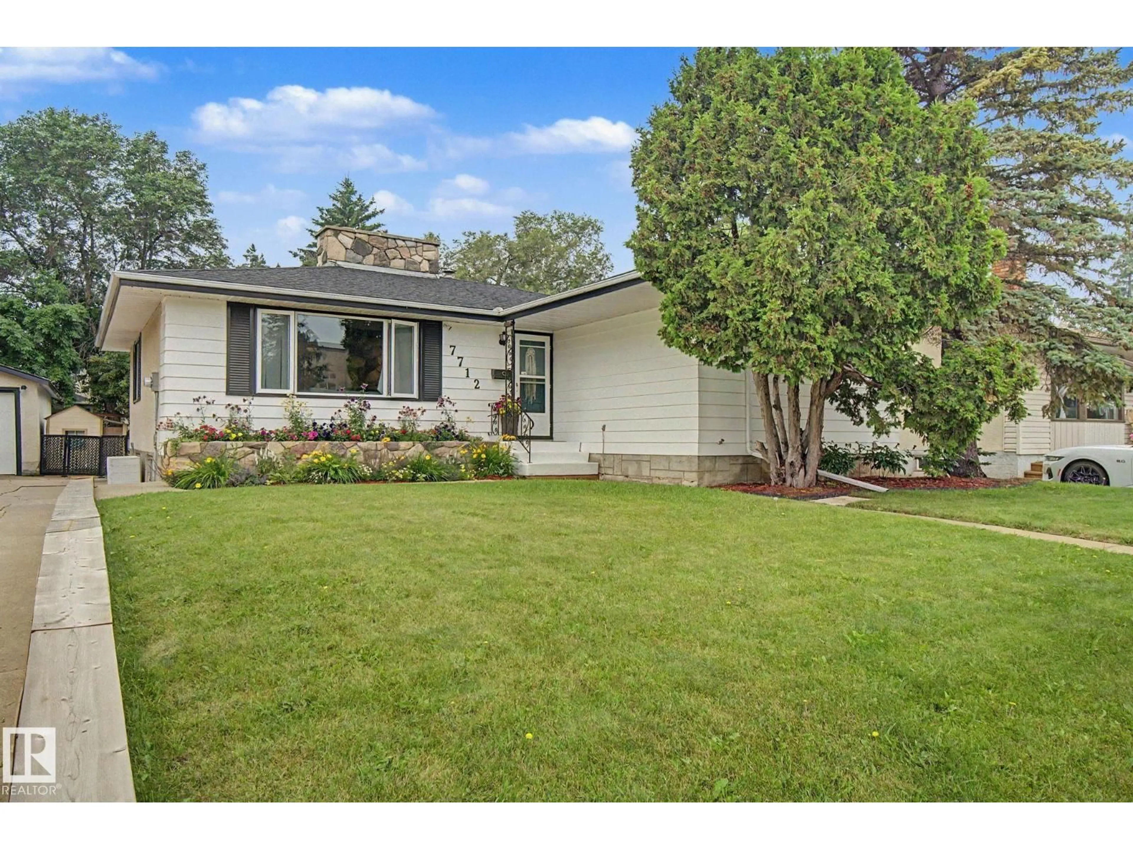 Home with vinyl exterior material, street for NW - 7712 159 ST, Edmonton Alberta T5R2C8