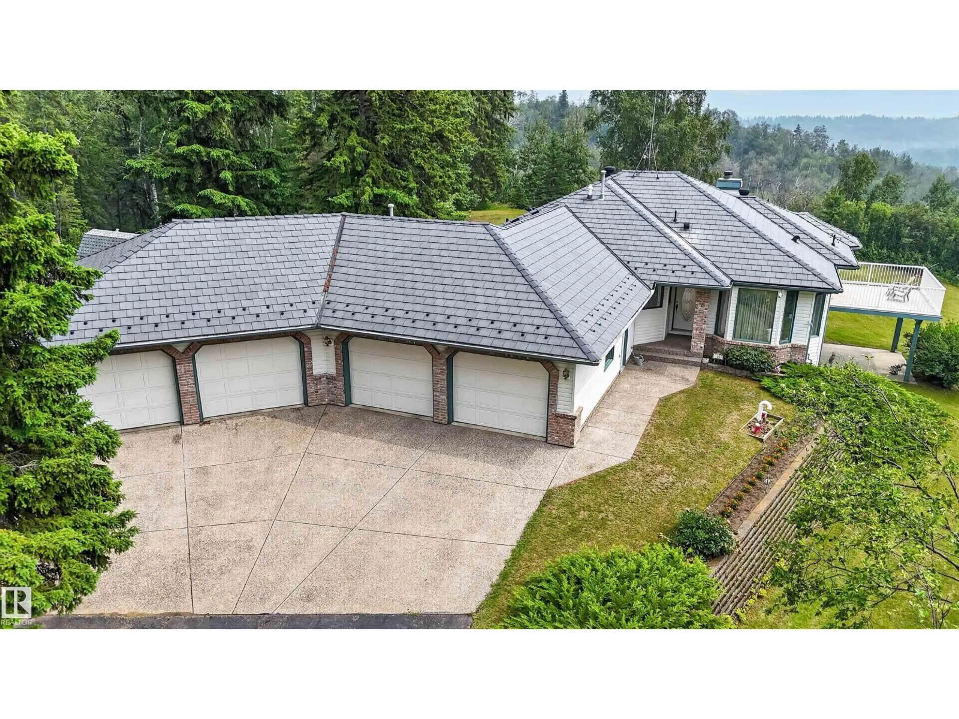 A pic from outside/outdoor area/front of a property/back of a property/a pic from drone, street for 15 - 26123 TWP ROAD 511, Rural Parkland County Alberta T7Y1B9