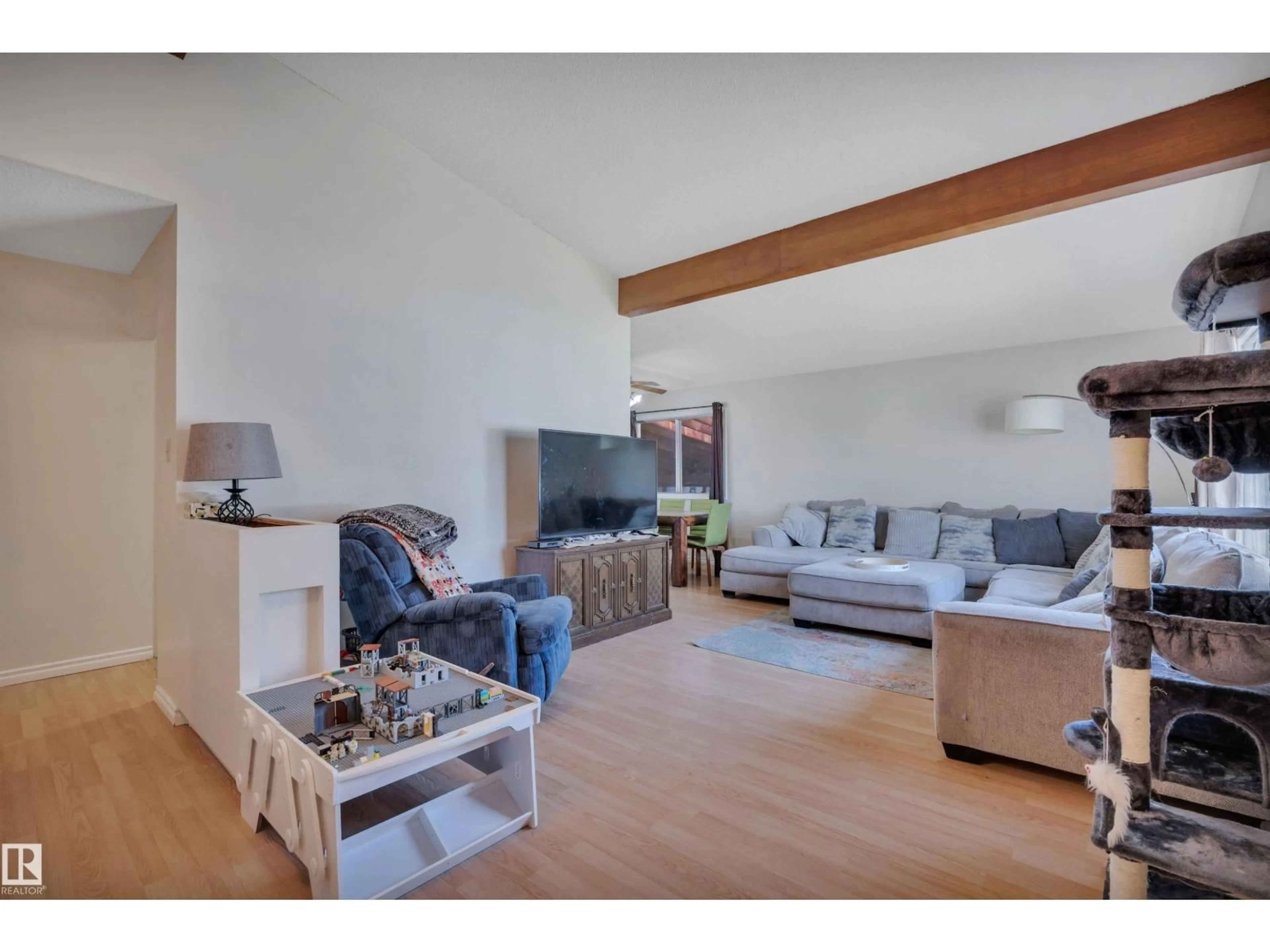 Living room with furniture, wood/laminate floor for 5411 44 AVE, Wetaskiwin Alberta T9A0C6