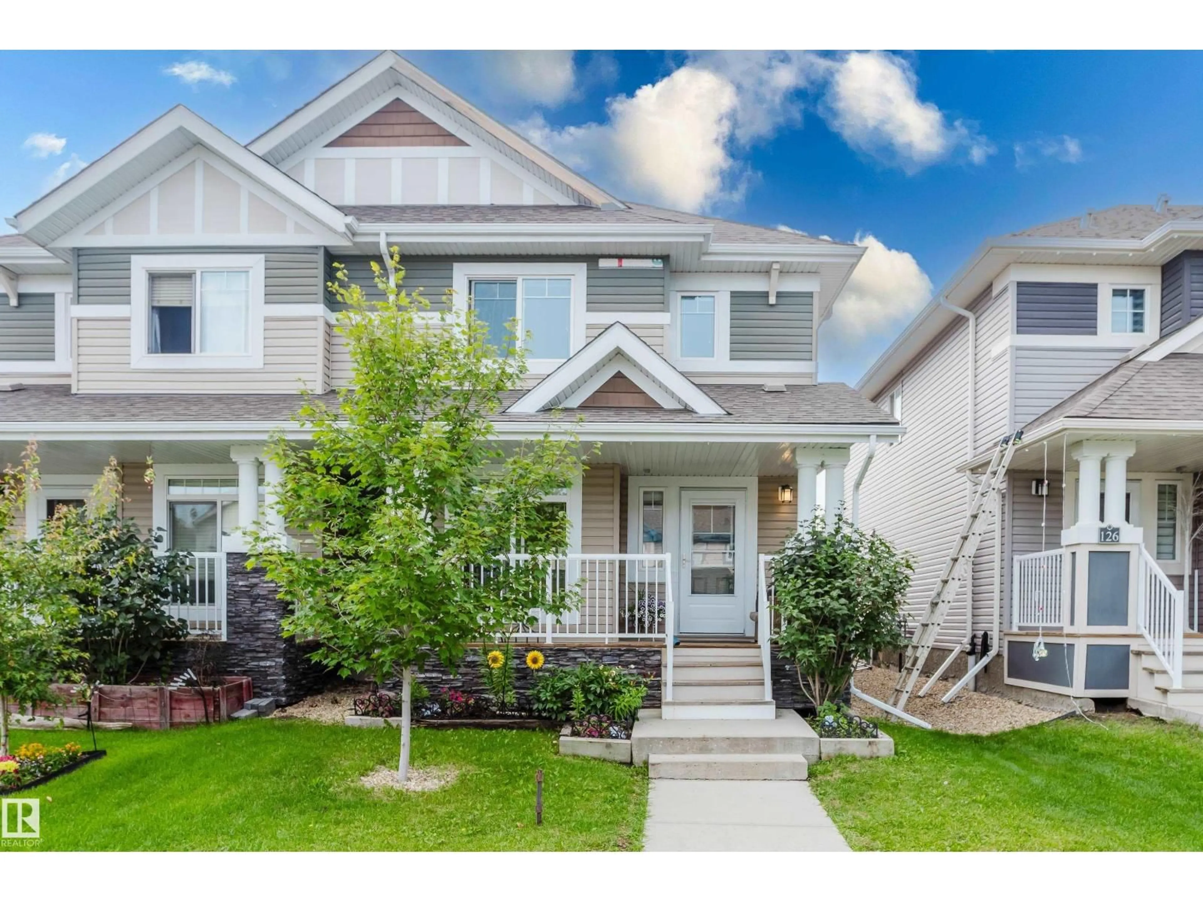 Home with vinyl exterior material, street for 124 CY BECKER BV, Edmonton Alberta T5Y0X9