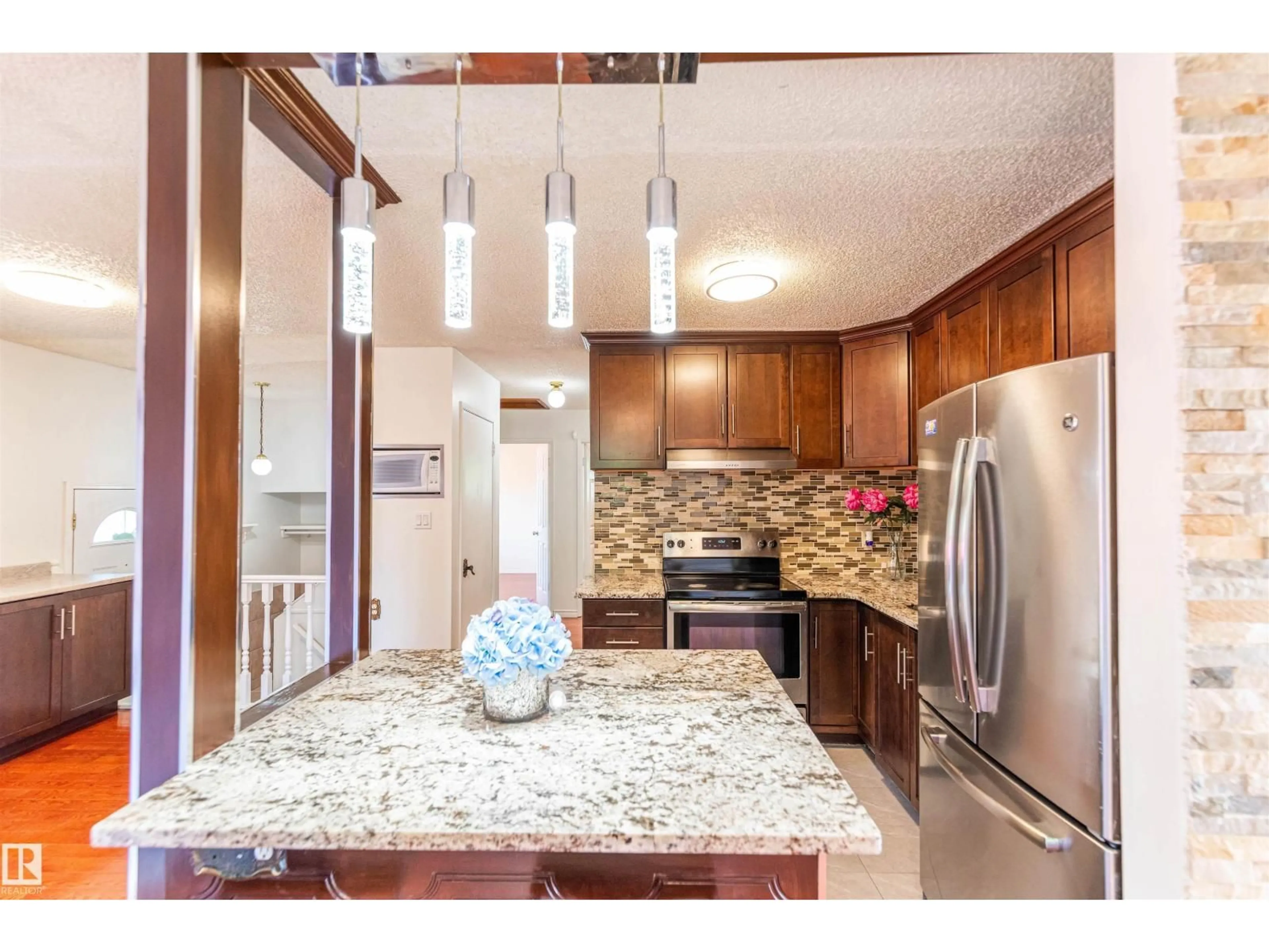 Open concept kitchen, ceramic/tile floor for 16524 116 ST NW, Edmonton Alberta T5X3T8