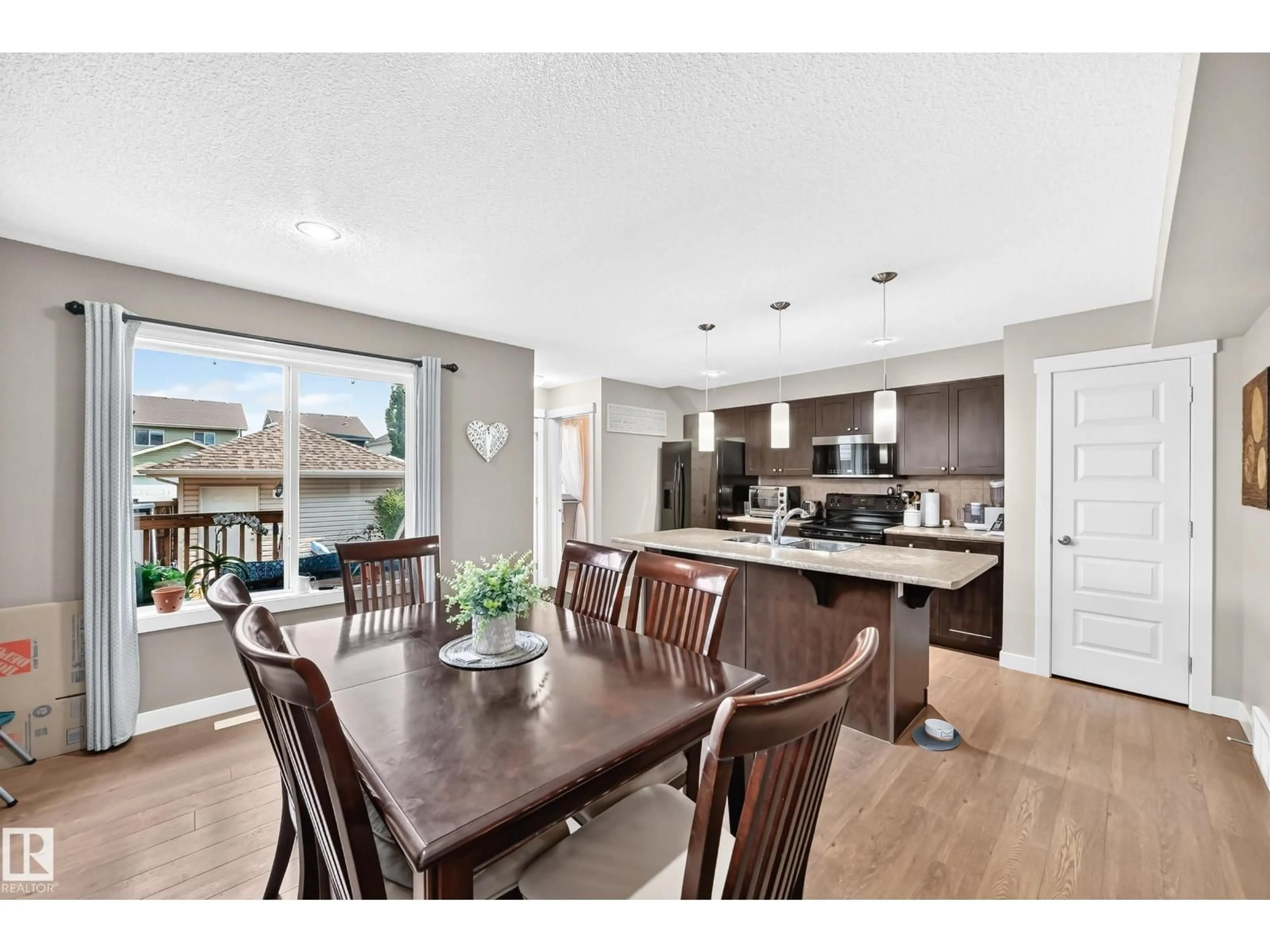 Open concept kitchen, wood/laminate floor for 466 CHAPPELLE DR, Edmonton Alberta T6W2B3