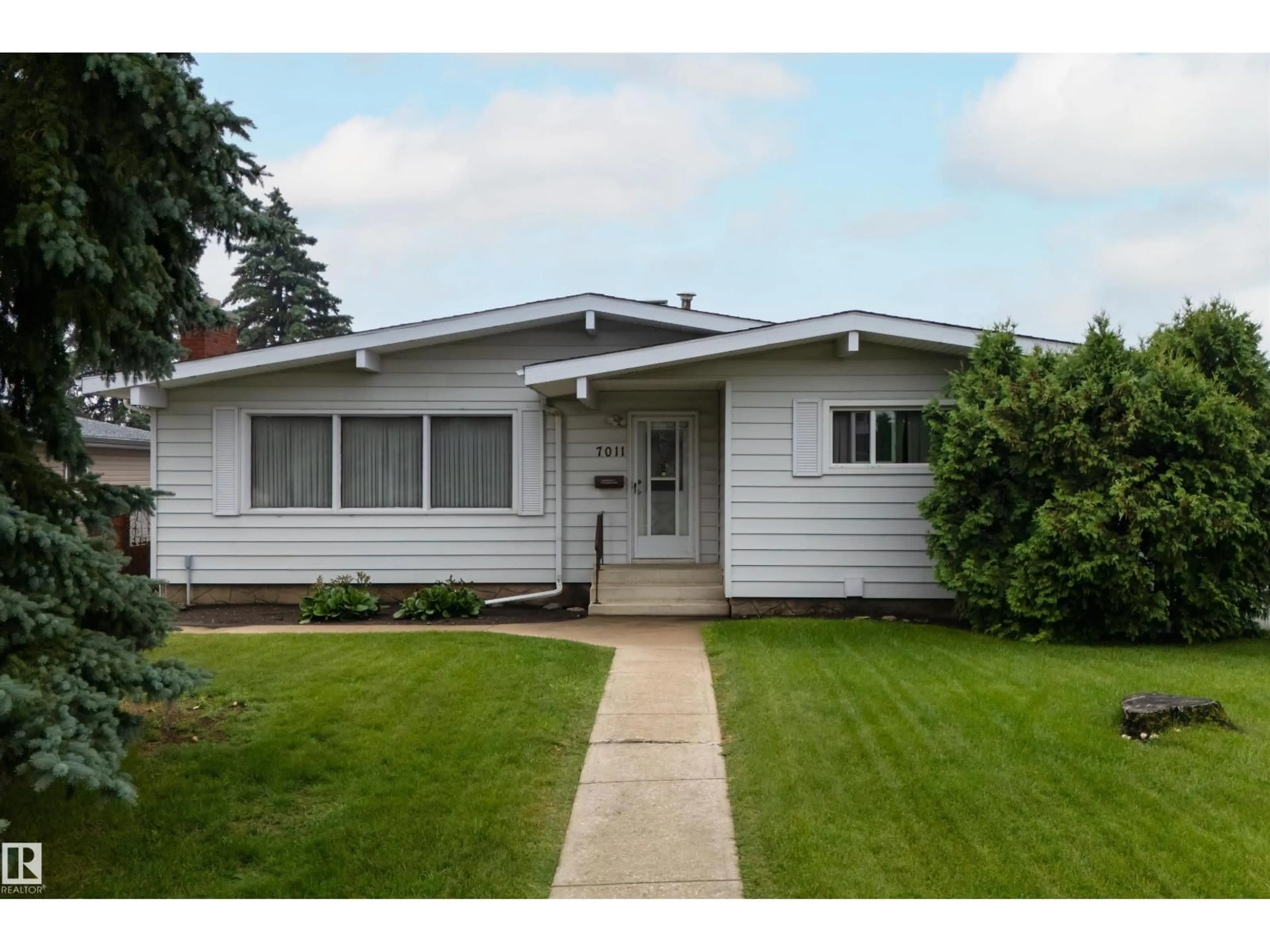 Home with vinyl exterior material, street for 7011 141 AVENUE AVENUE, Edmonton Alberta T5C2M9