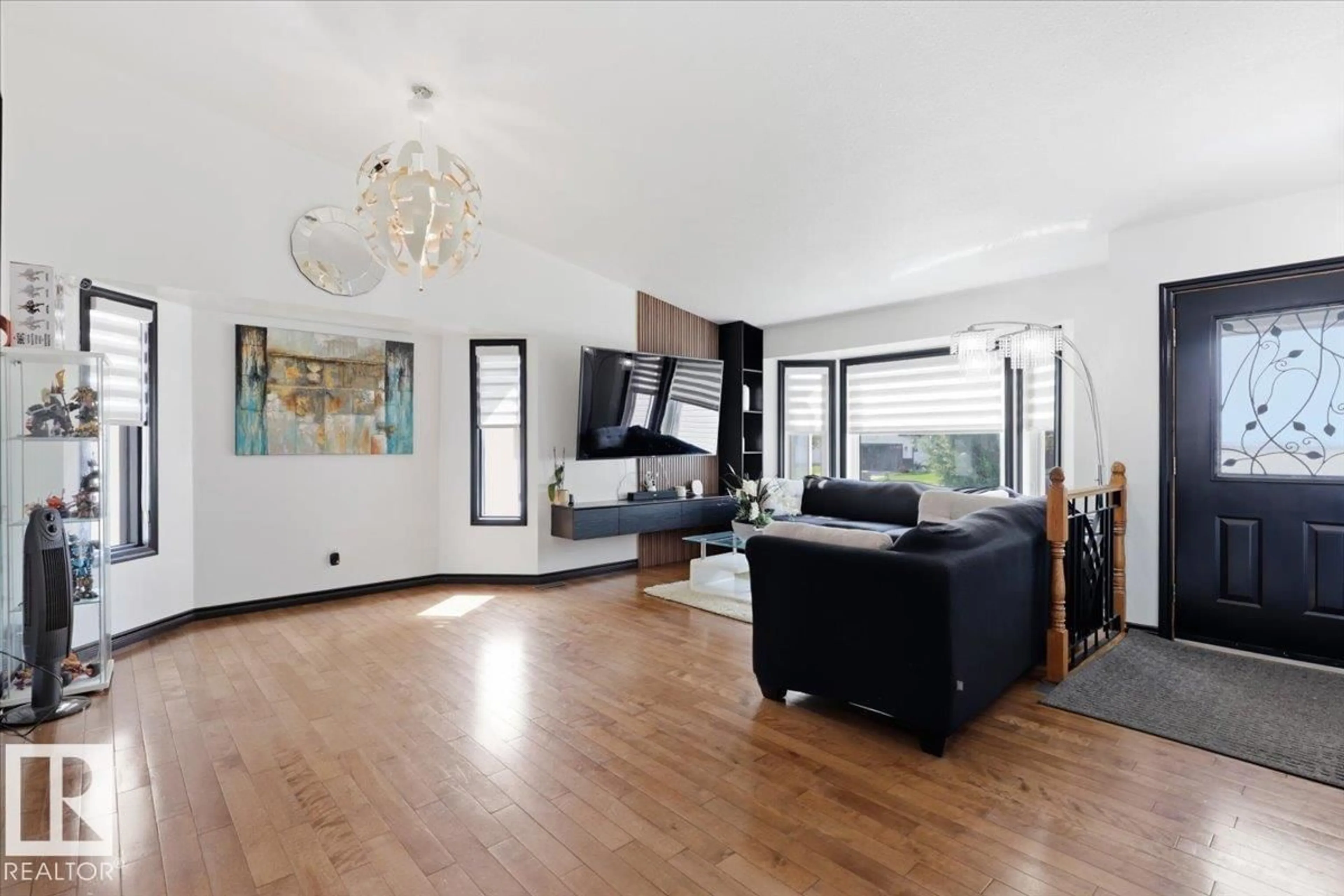Living room with furniture, wood/laminate floor for 242 NORTHMOUNT DR, Wetaskiwin Alberta T9A3M4