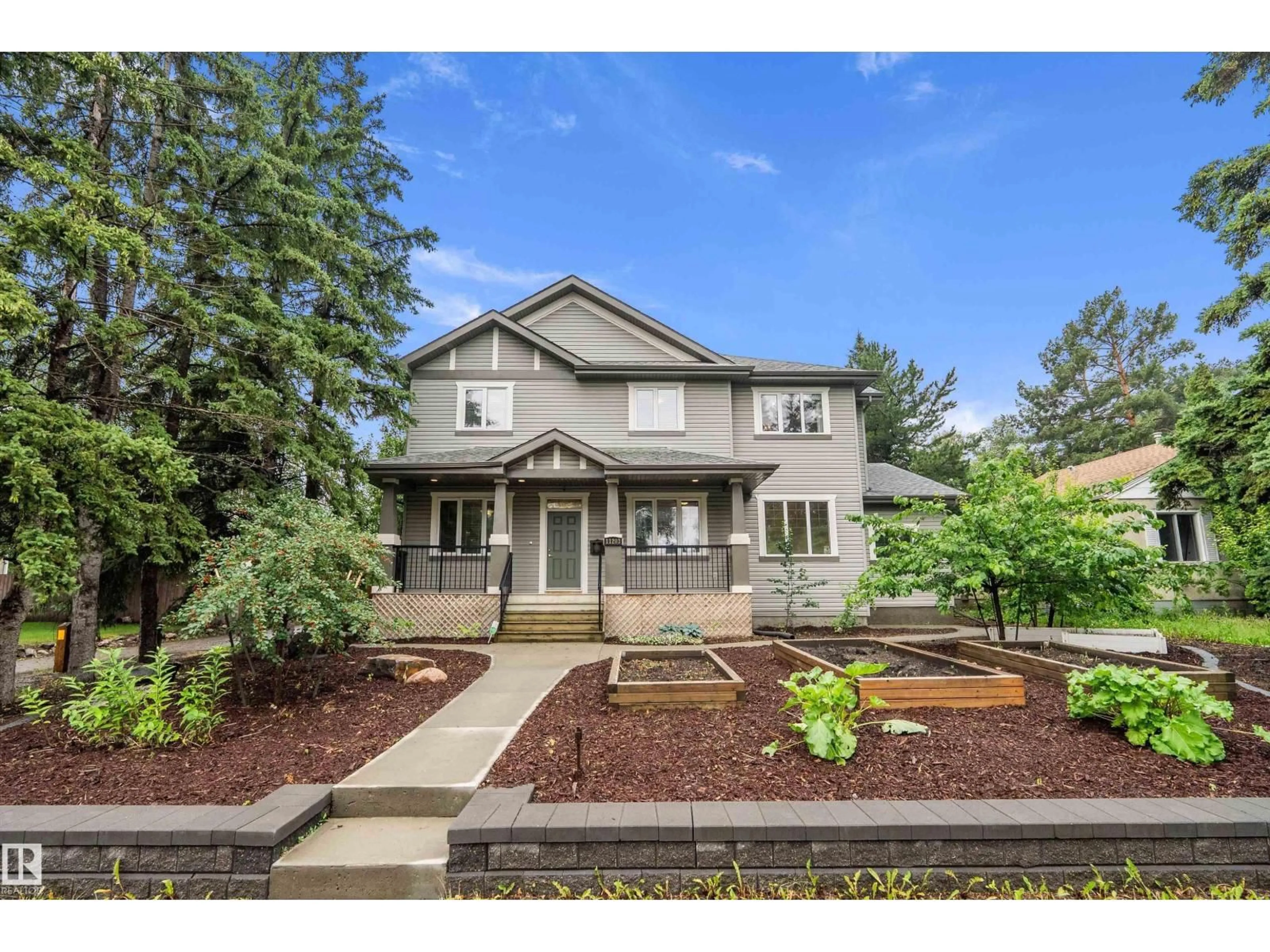 Home with vinyl exterior material, street for 11203 72 AV, Edmonton Alberta T6G0B4