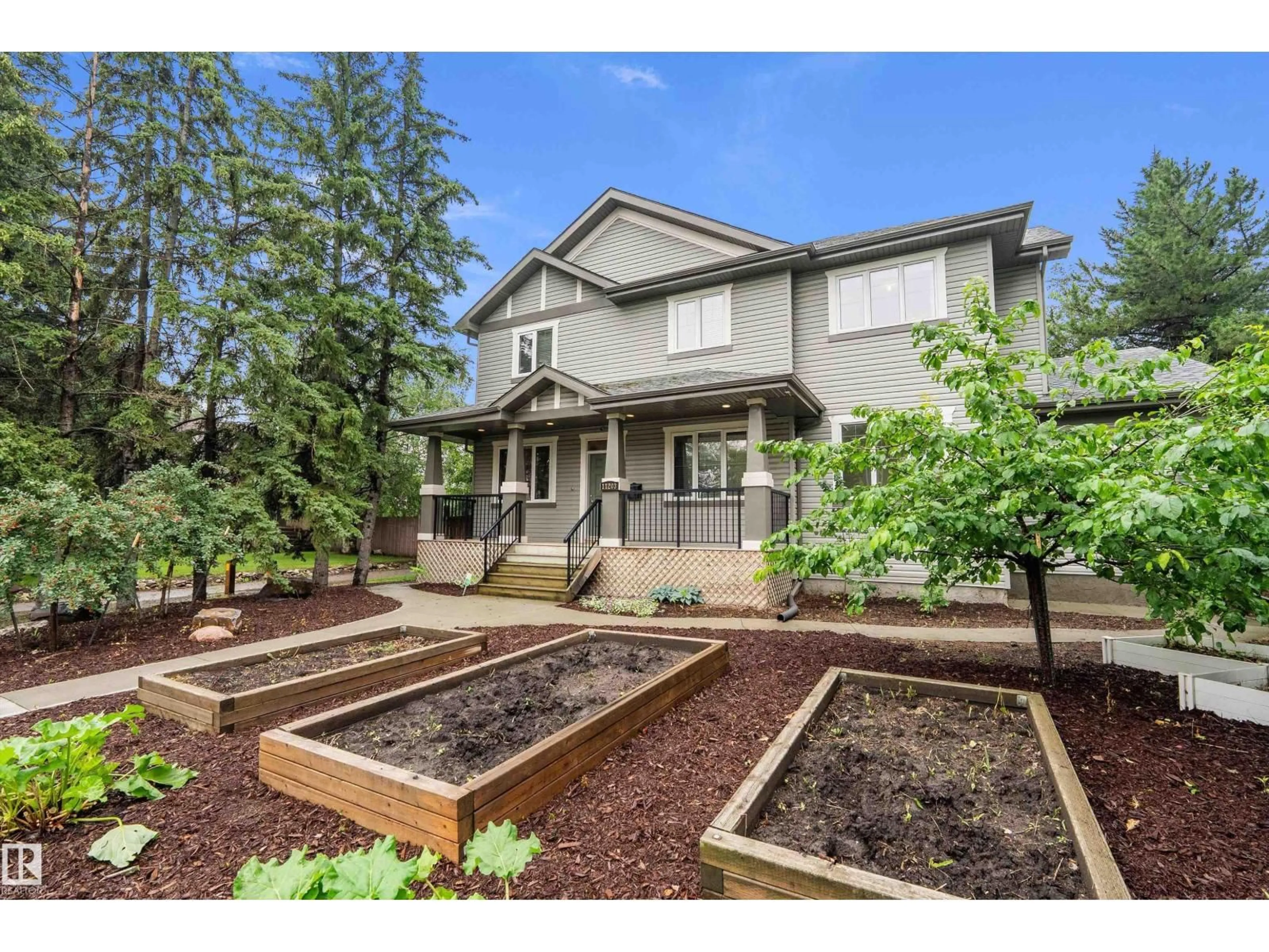 Home with vinyl exterior material, street for 11203 72 AV, Edmonton Alberta T6G0B4
