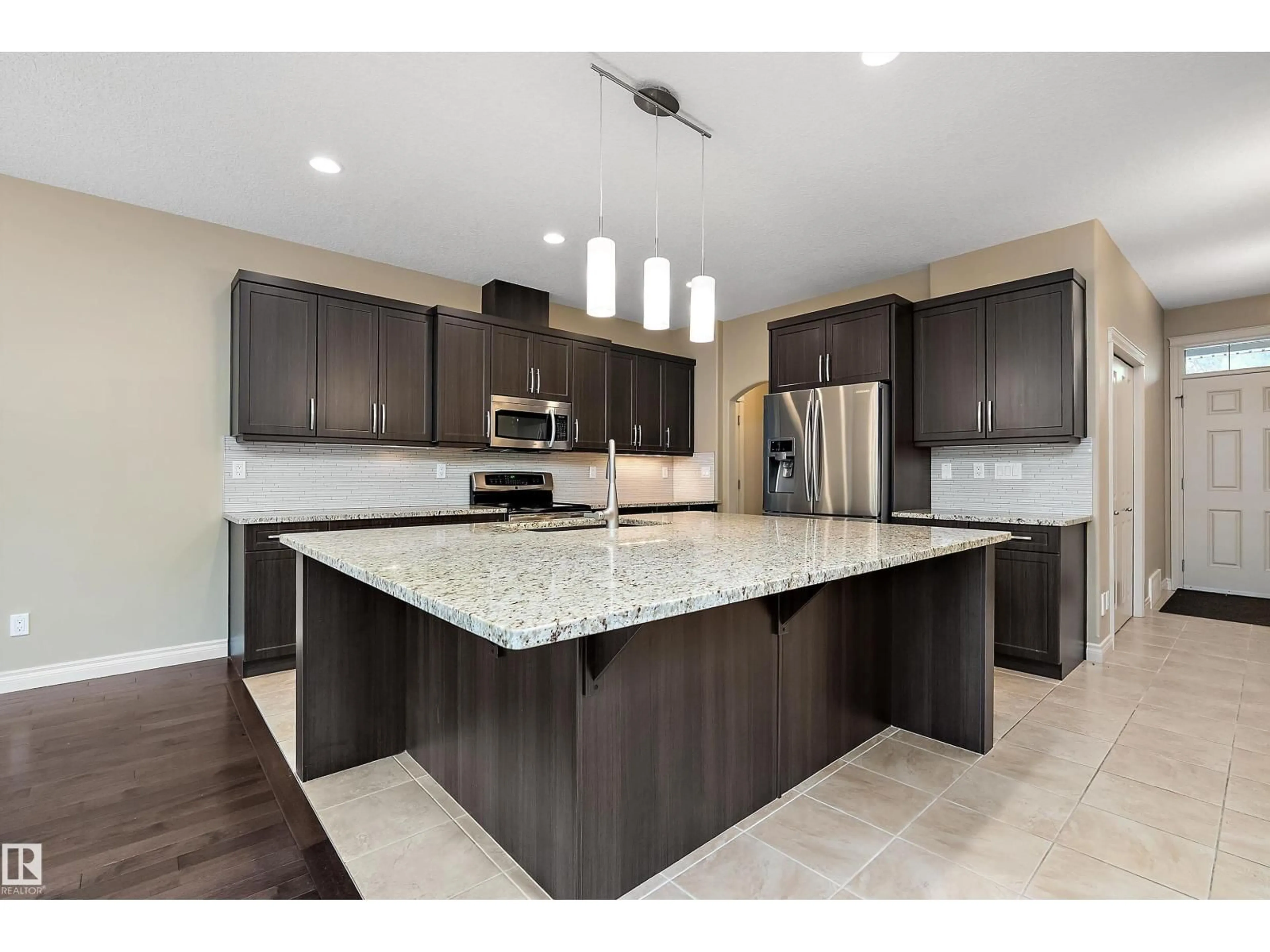 Open concept kitchen, ceramic/tile floor for 11203 72 AV, Edmonton Alberta T6G0B4