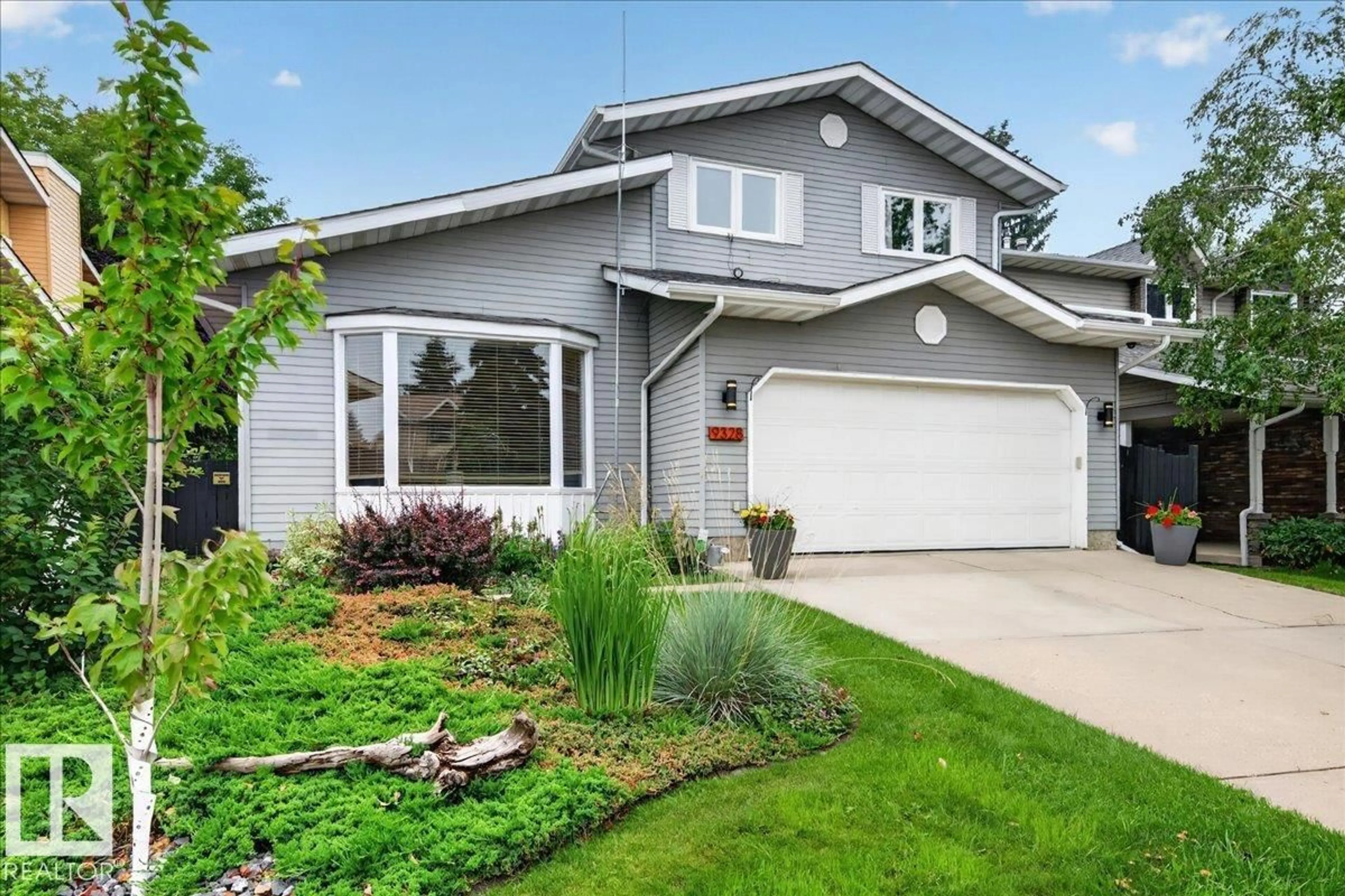 Home with vinyl exterior material, street for 9328 173 ST, Edmonton Alberta T5T3C5