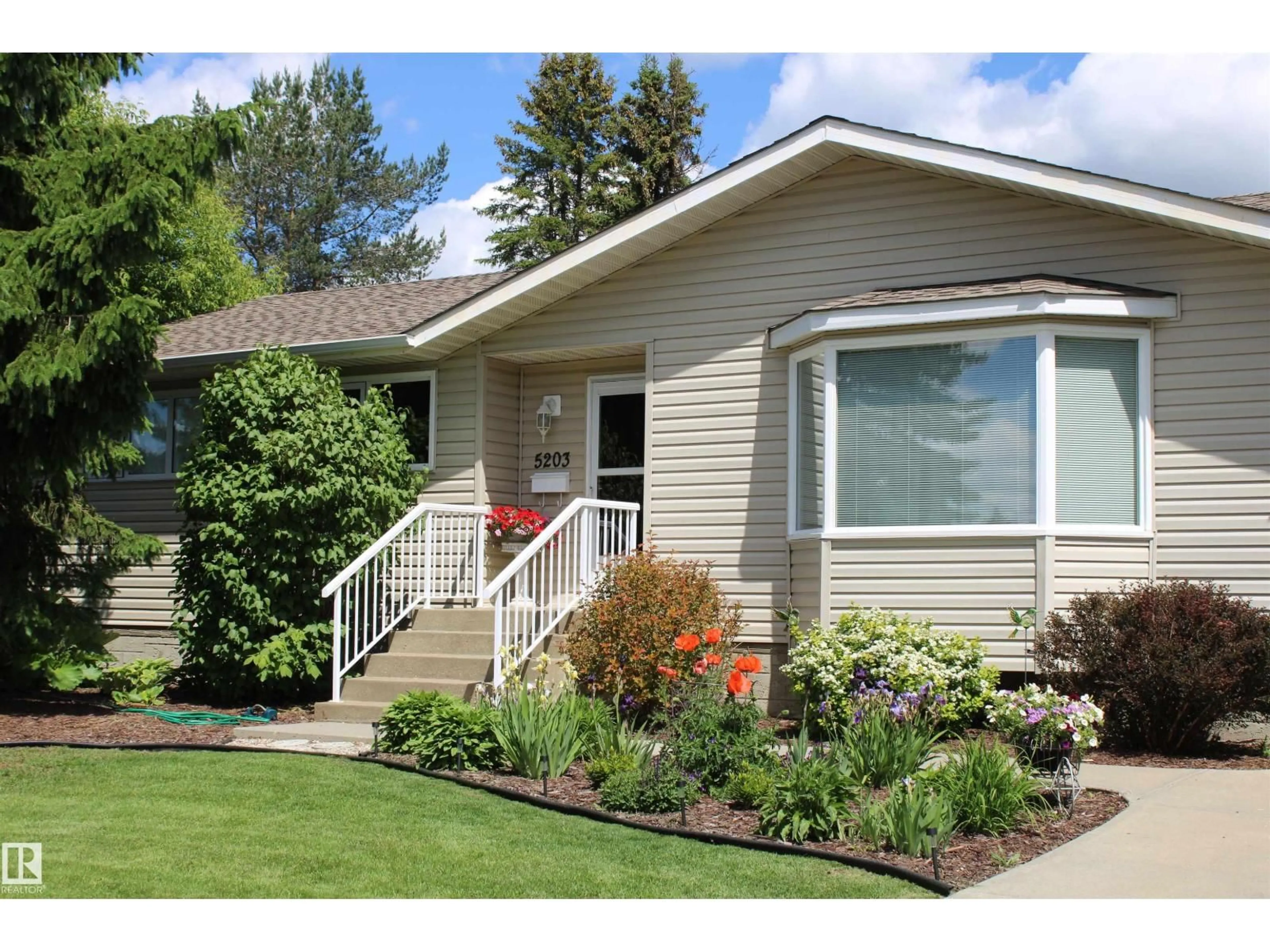 Home with vinyl exterior material, street for 5203 45 ST, Beaumont Alberta T4X1J1
