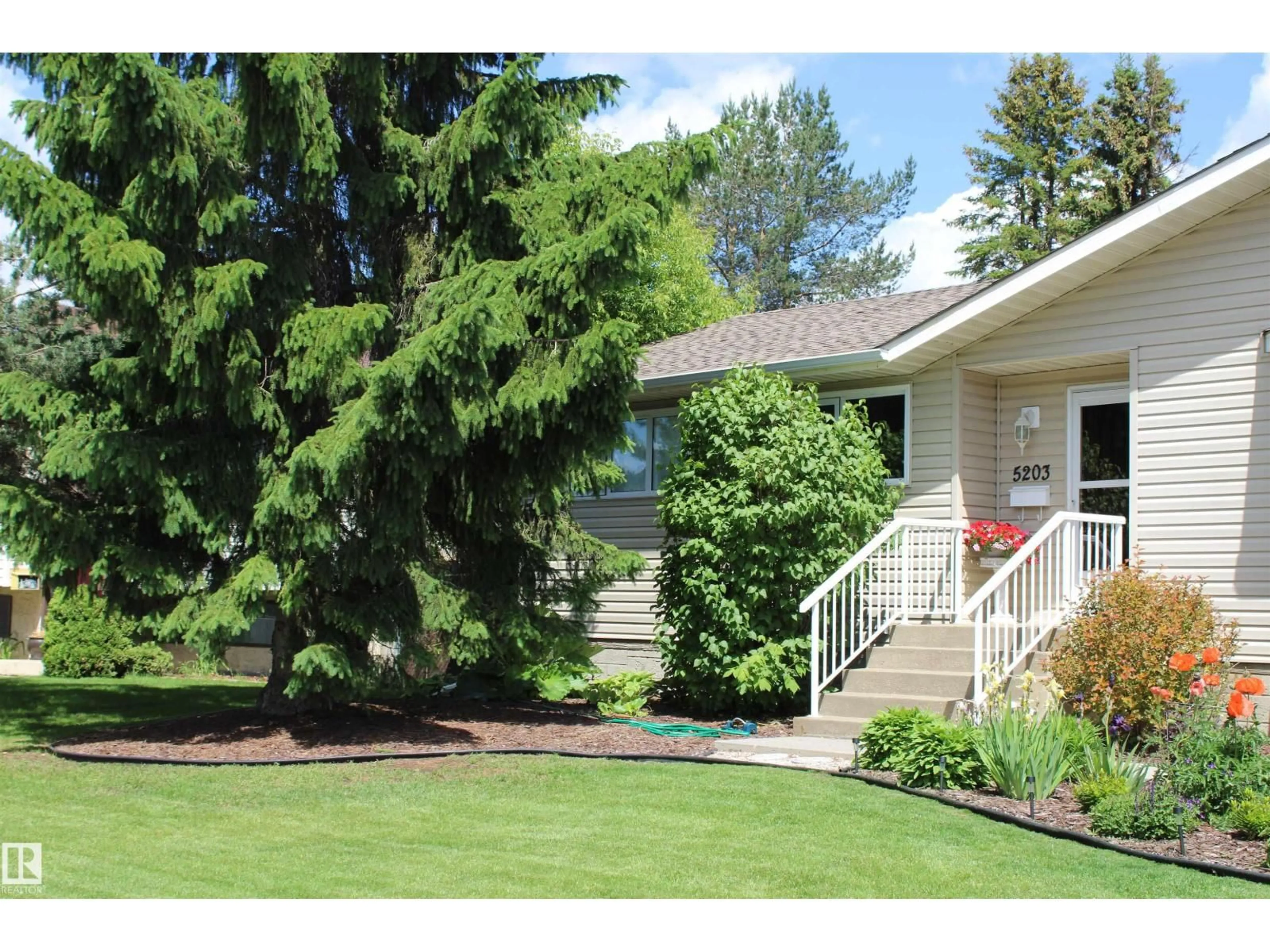 Home with vinyl exterior material, street for 5203 45 ST, Beaumont Alberta T4X1J1