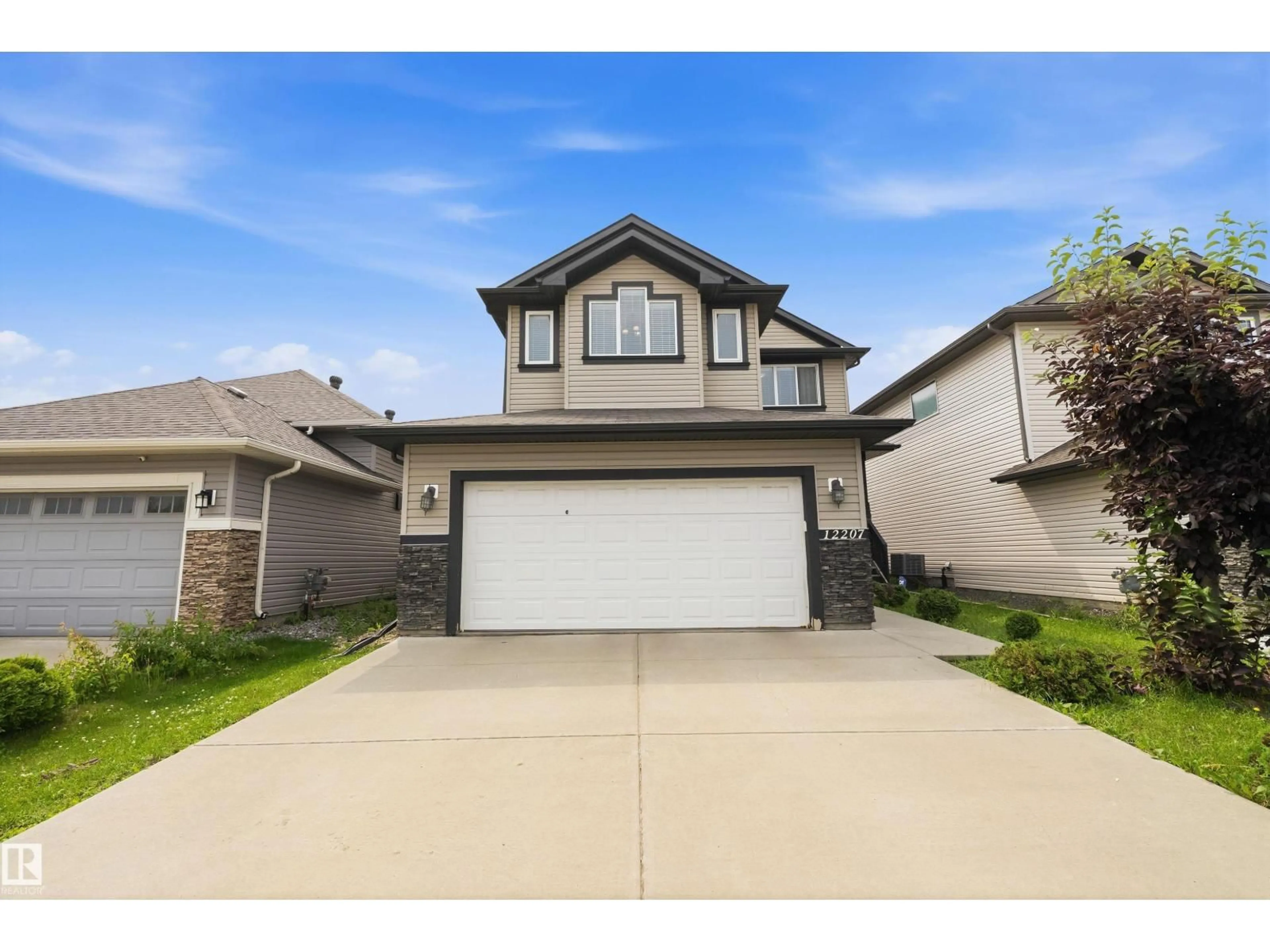 Home with vinyl exterior material, street for 12207 172 AV, Edmonton Alberta T5X0H3