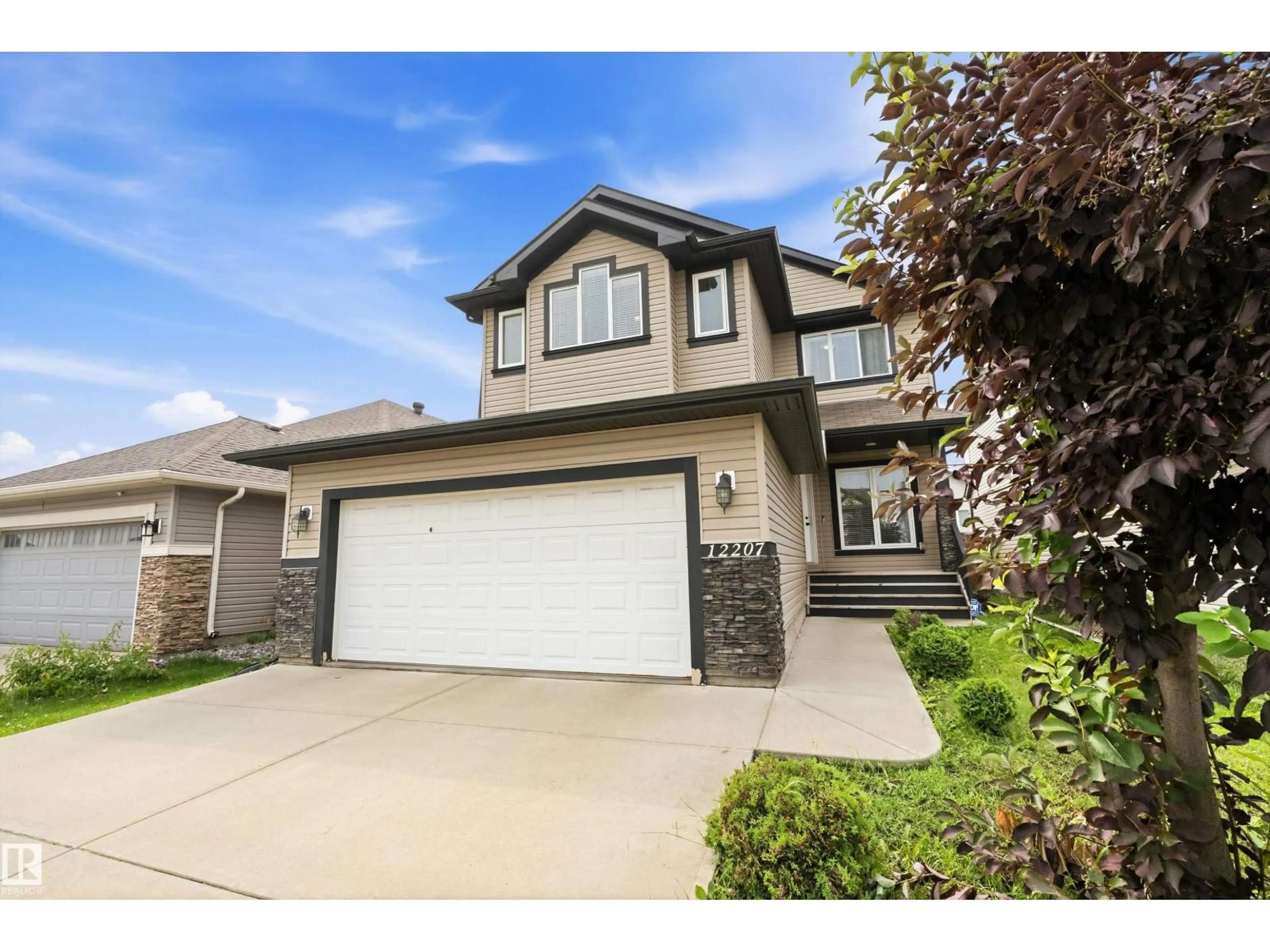 Home with vinyl exterior material, street for 12207 172 AV, Edmonton Alberta T5X0H3