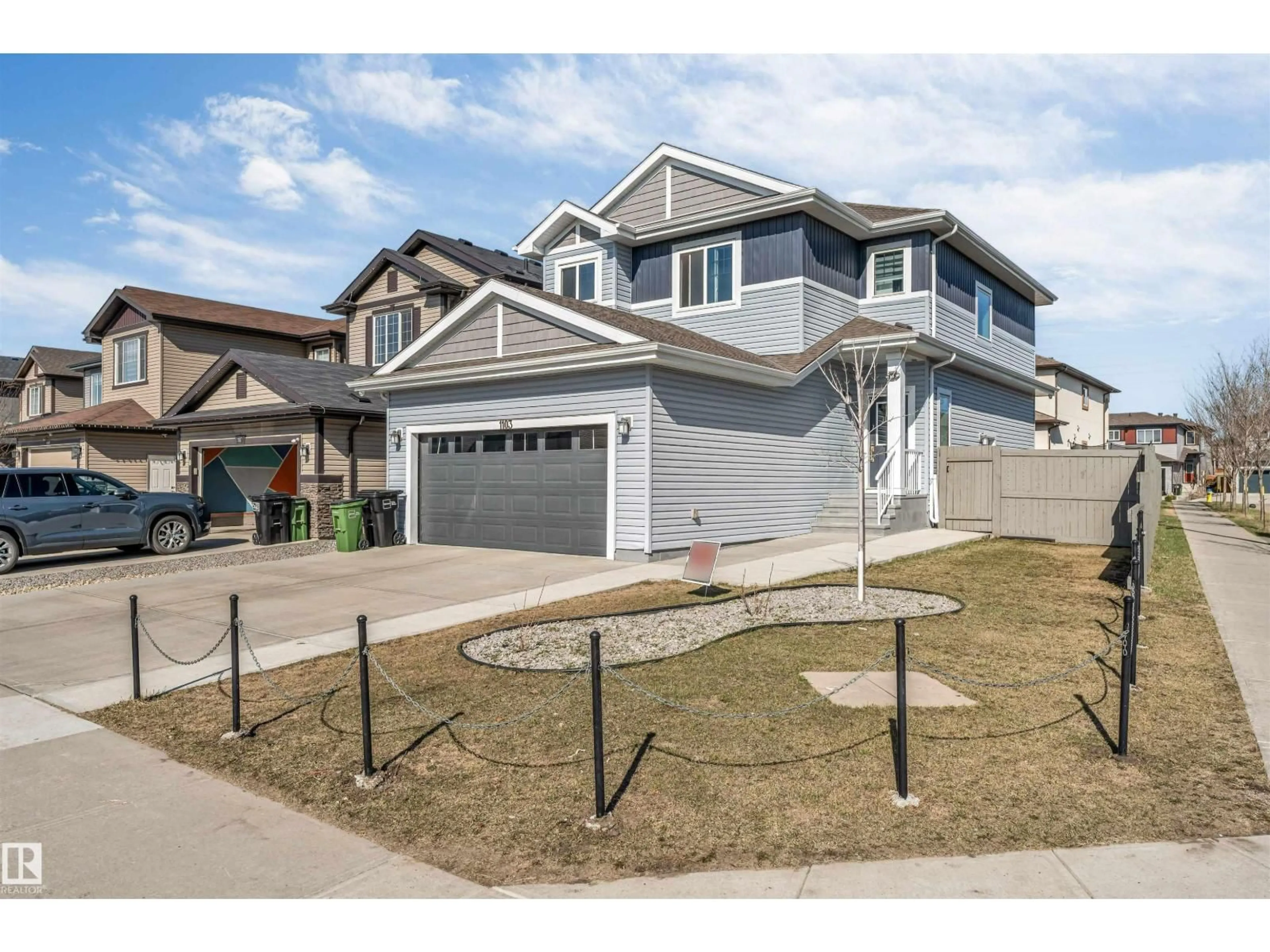 Home with vinyl exterior material, street for NW - 1103 29 ST, Edmonton Alberta T6T2H3