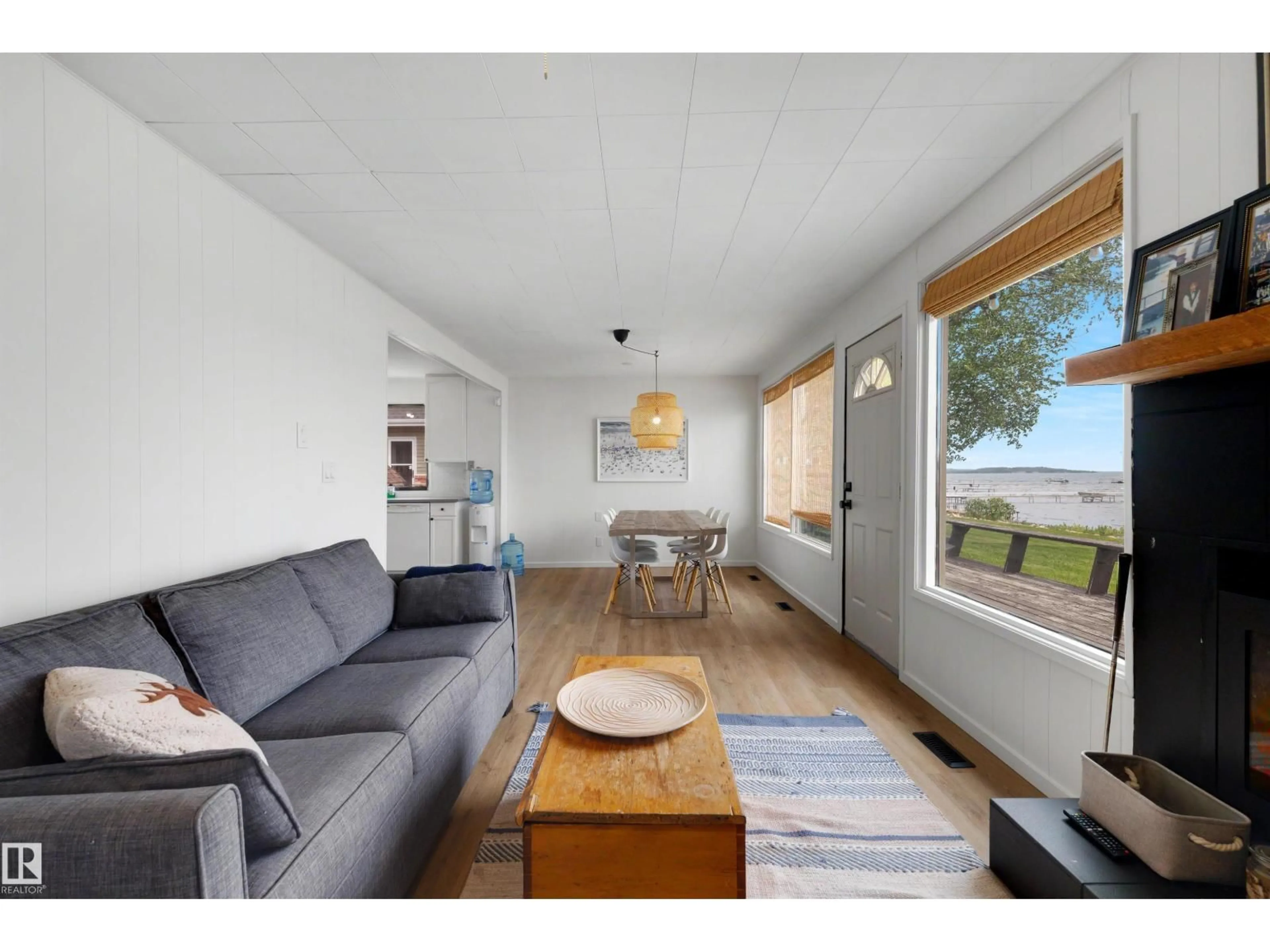 Living room with furniture, wood/laminate floor for 595 1 AV, Rural Parkland County Alberta T0E2B0