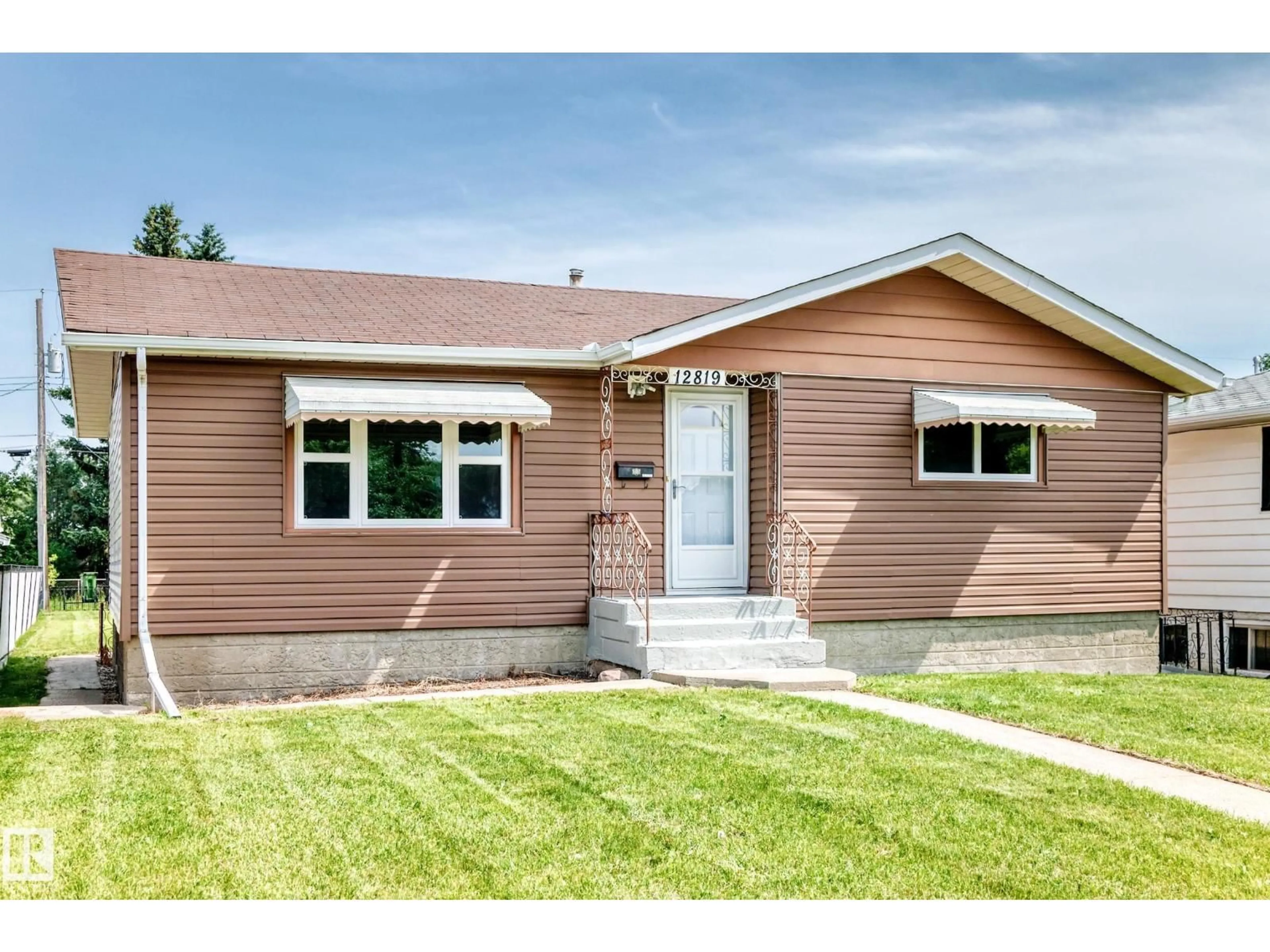 Home with vinyl exterior material, street for 12819 107 ST, Edmonton Alberta T5E4V4