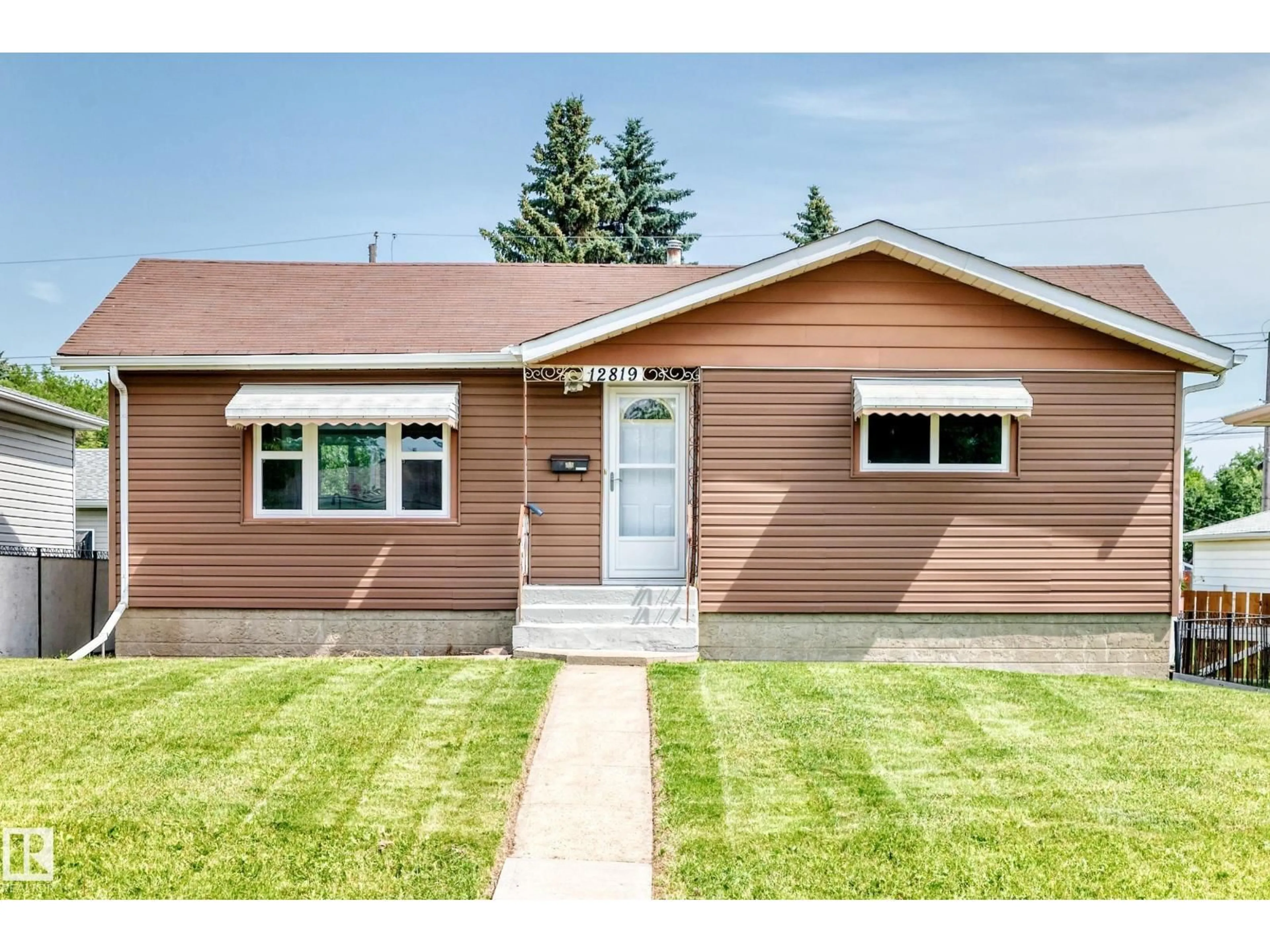 Home with vinyl exterior material, street for 12819 107 ST, Edmonton Alberta T5E4V4