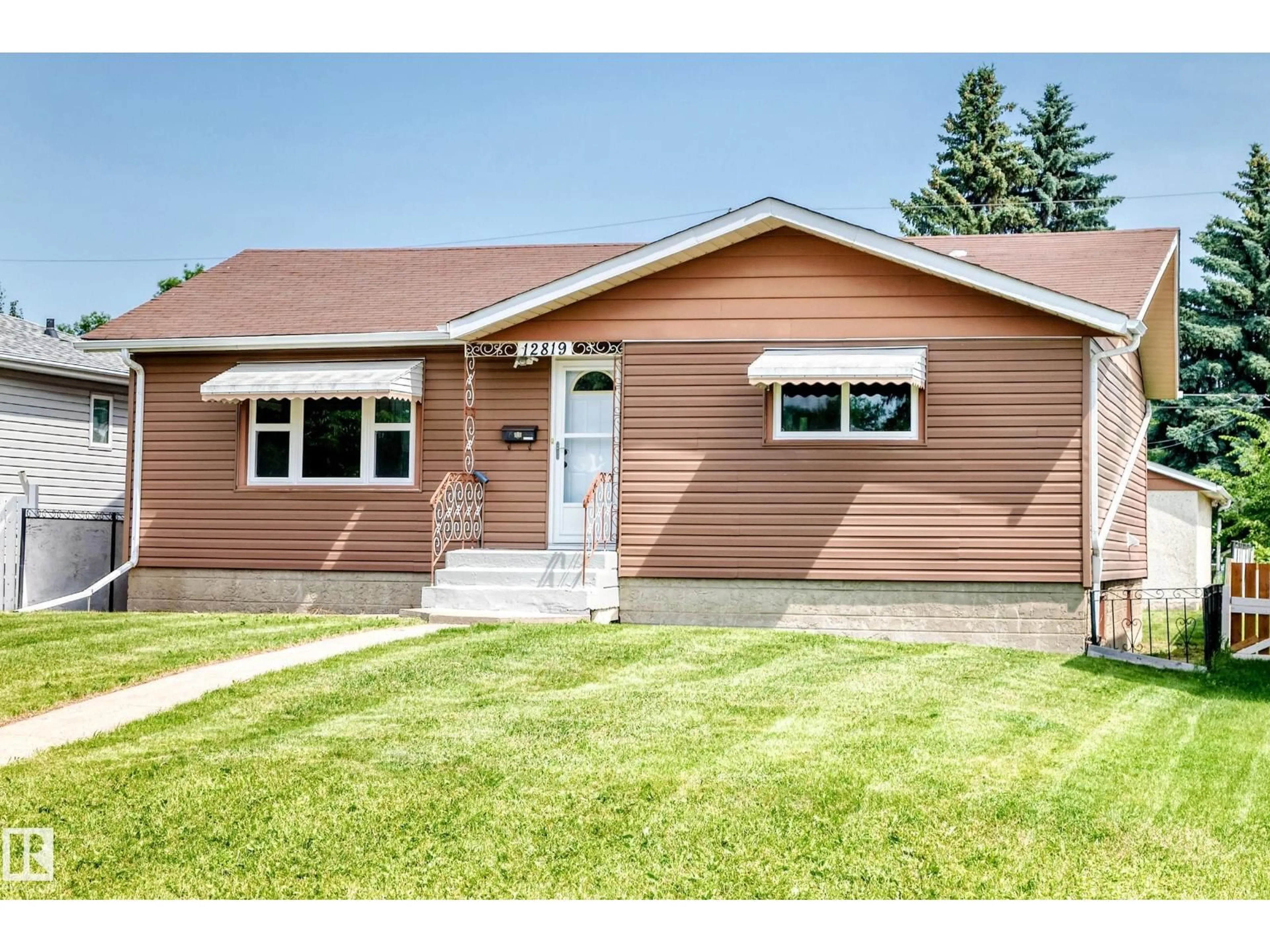 Home with vinyl exterior material, street for 12819 107 ST, Edmonton Alberta T5E4V4