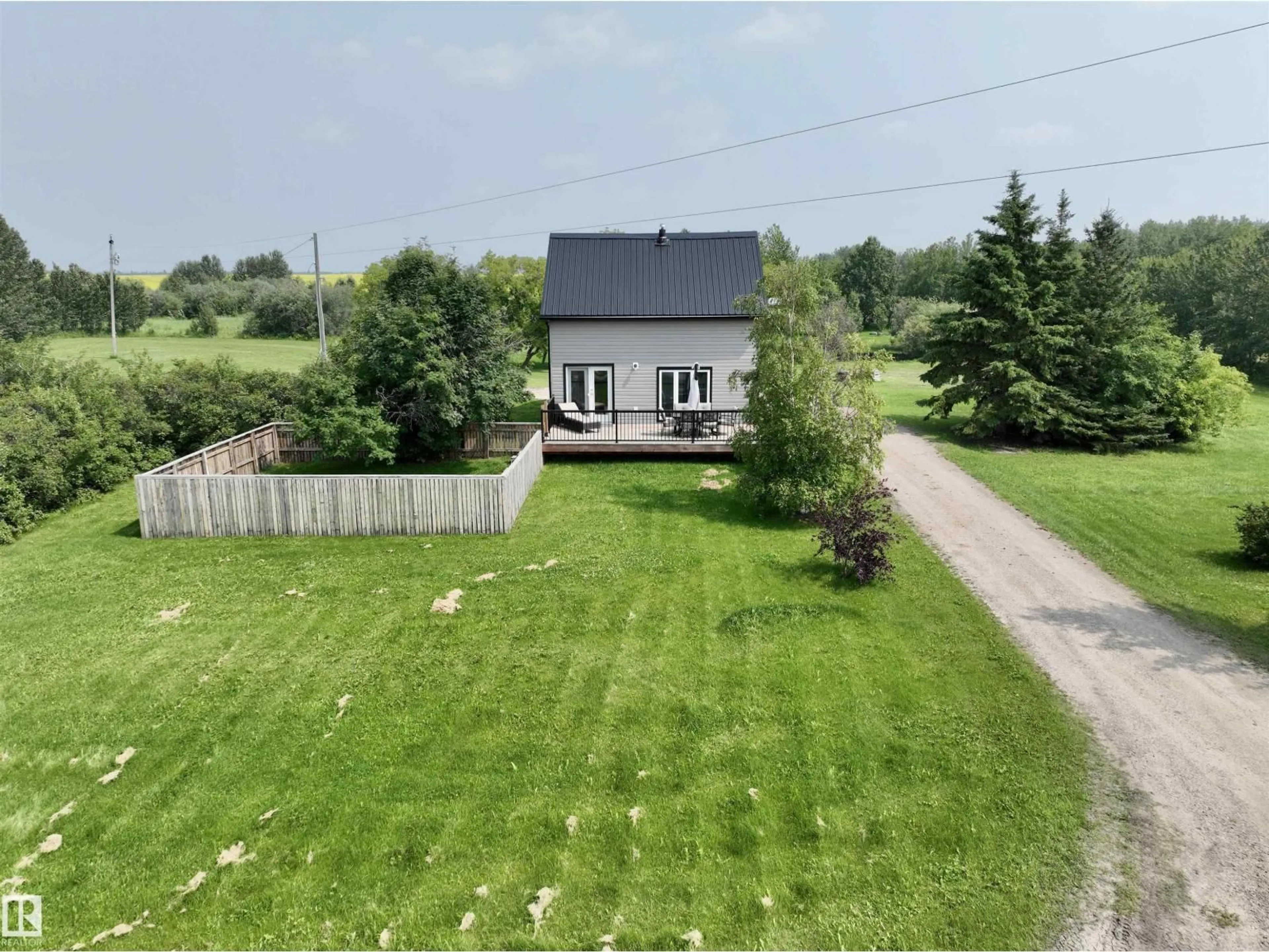A pic from outside/outdoor area/front of a property/back of a property/a pic from drone, unknown for 58571 RR 90, Rural St. Paul County Alberta T0A3A0