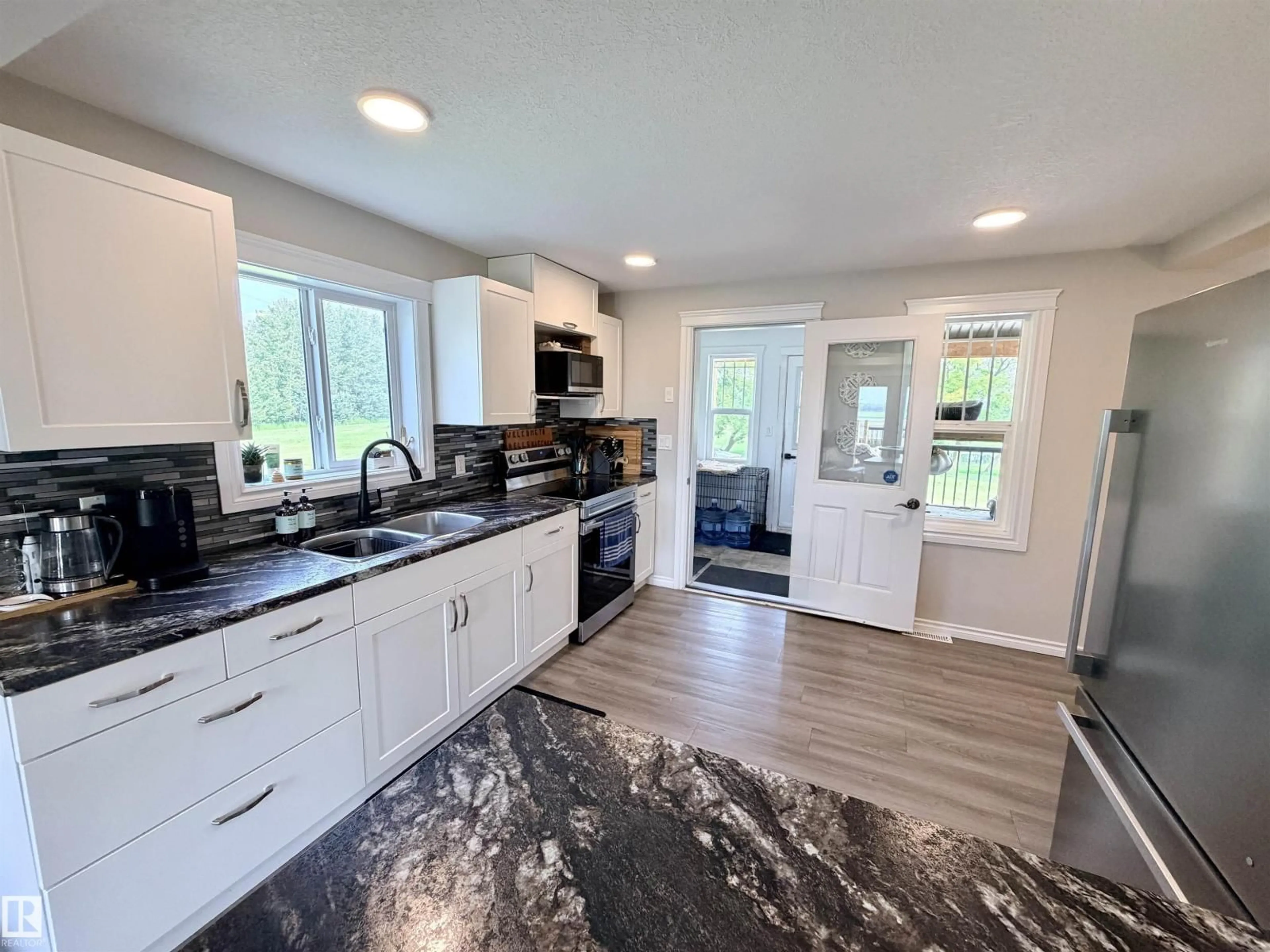 Open concept kitchen, ceramic/tile floor for 58571 RR 90, Rural St. Paul County Alberta T0A3A0