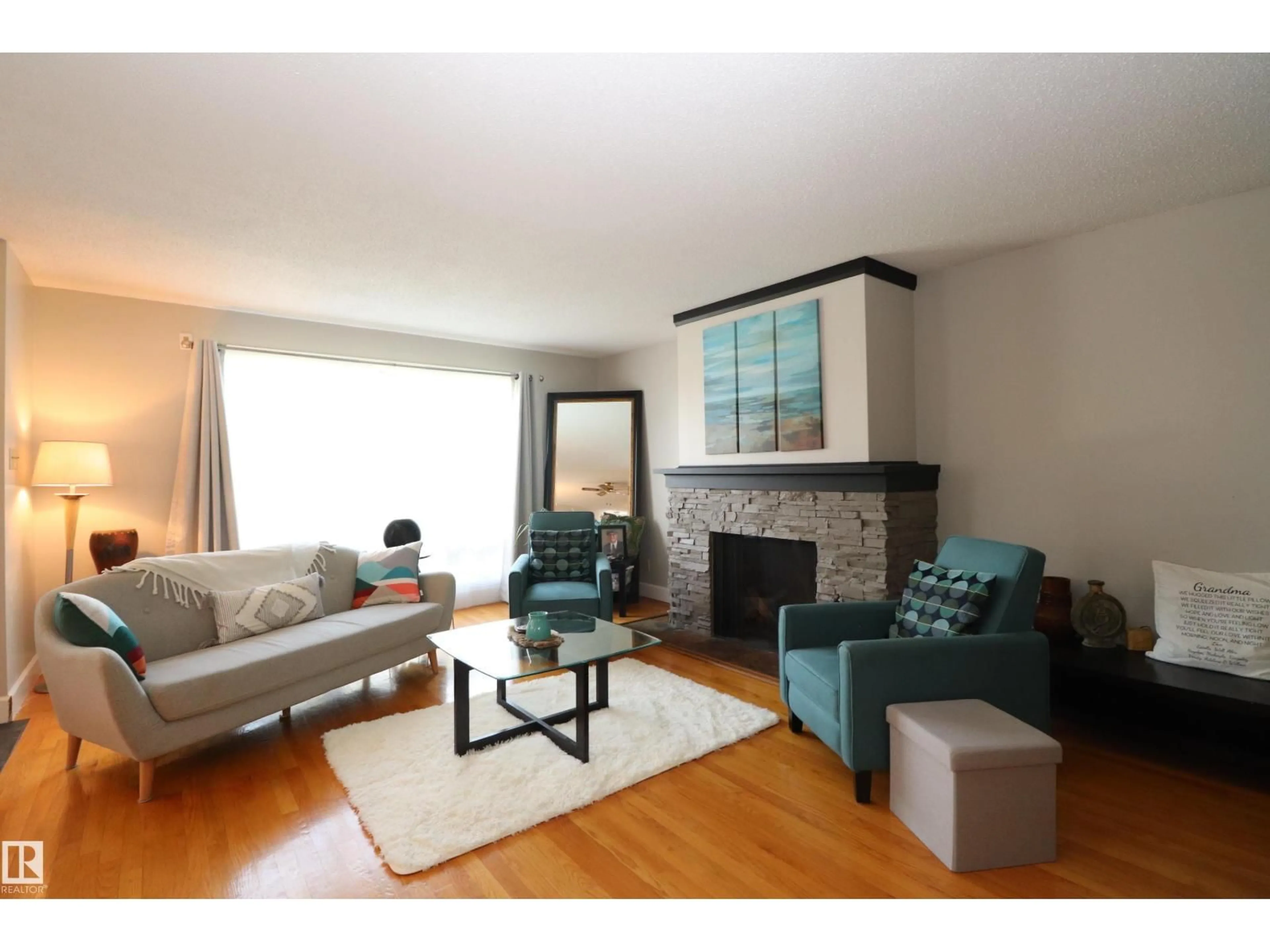 Living room with furniture, wood/laminate floor for 5017 46 AV, Vegreville Alberta T9C1L7