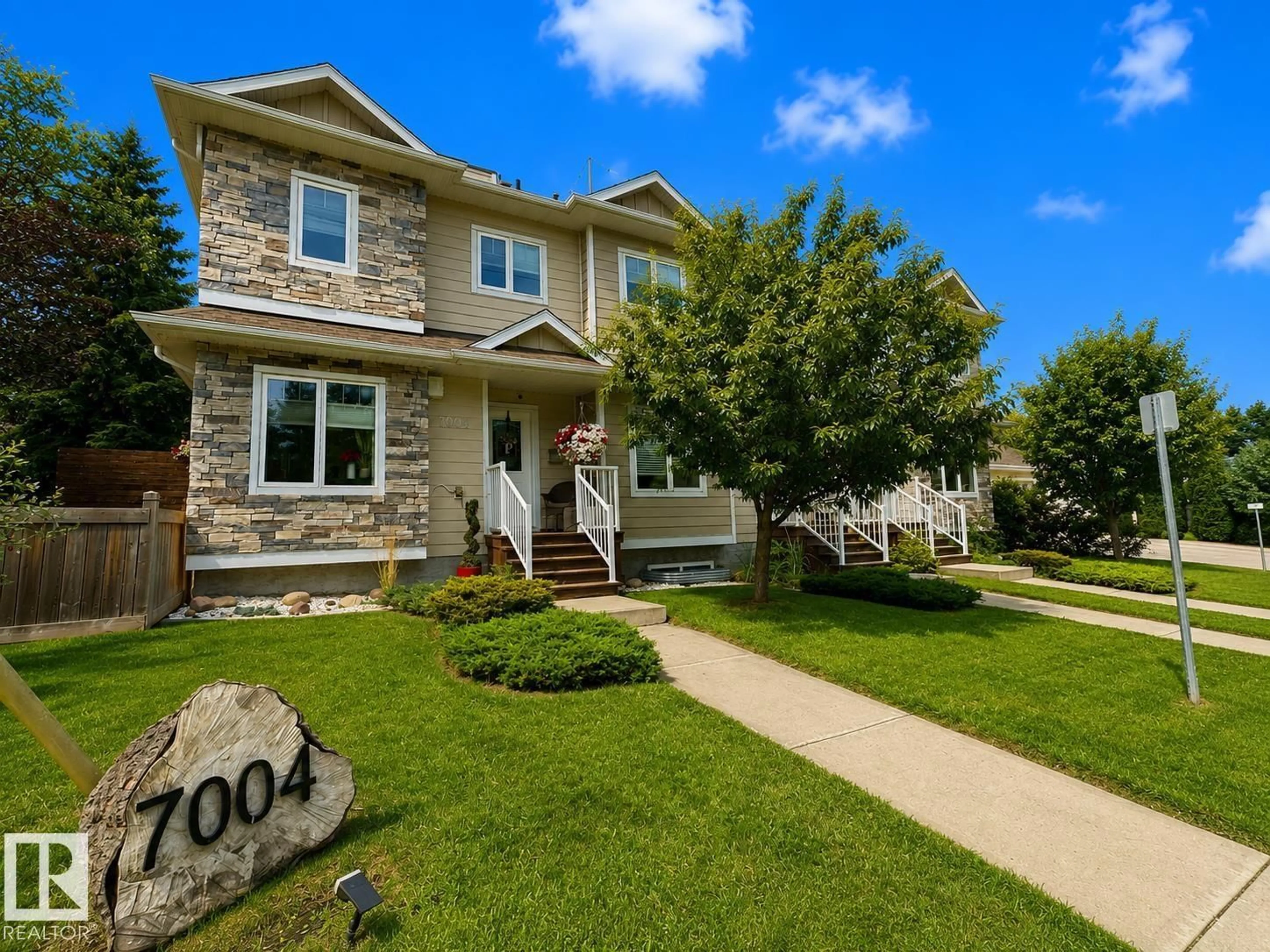 Home with vinyl exterior material, street for NW - 7004 97 ST, Edmonton Alberta T6E3K1
