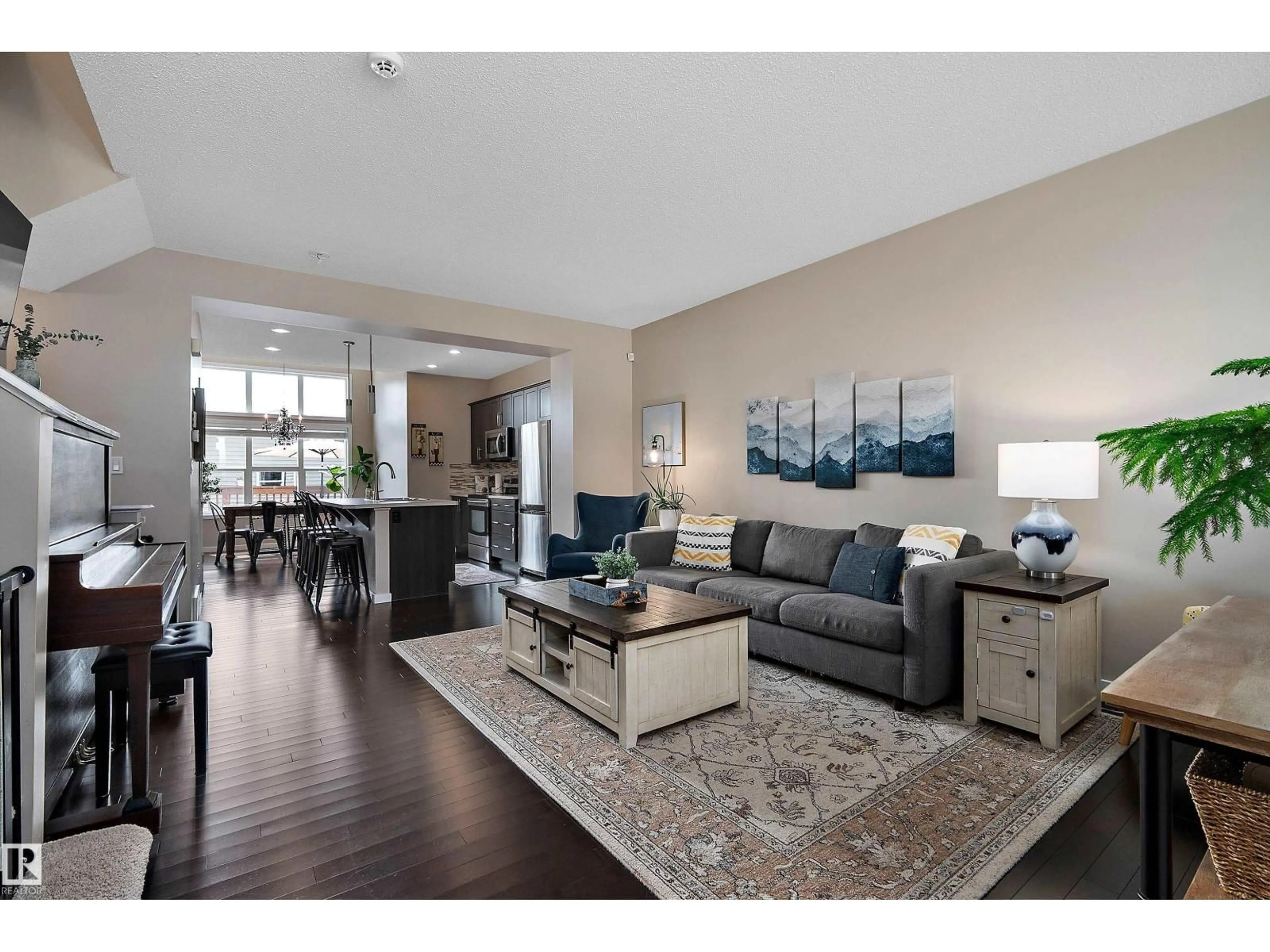Living room with furniture, wood/laminate floor for 21915 99 AV, Edmonton Alberta T5T4M5
