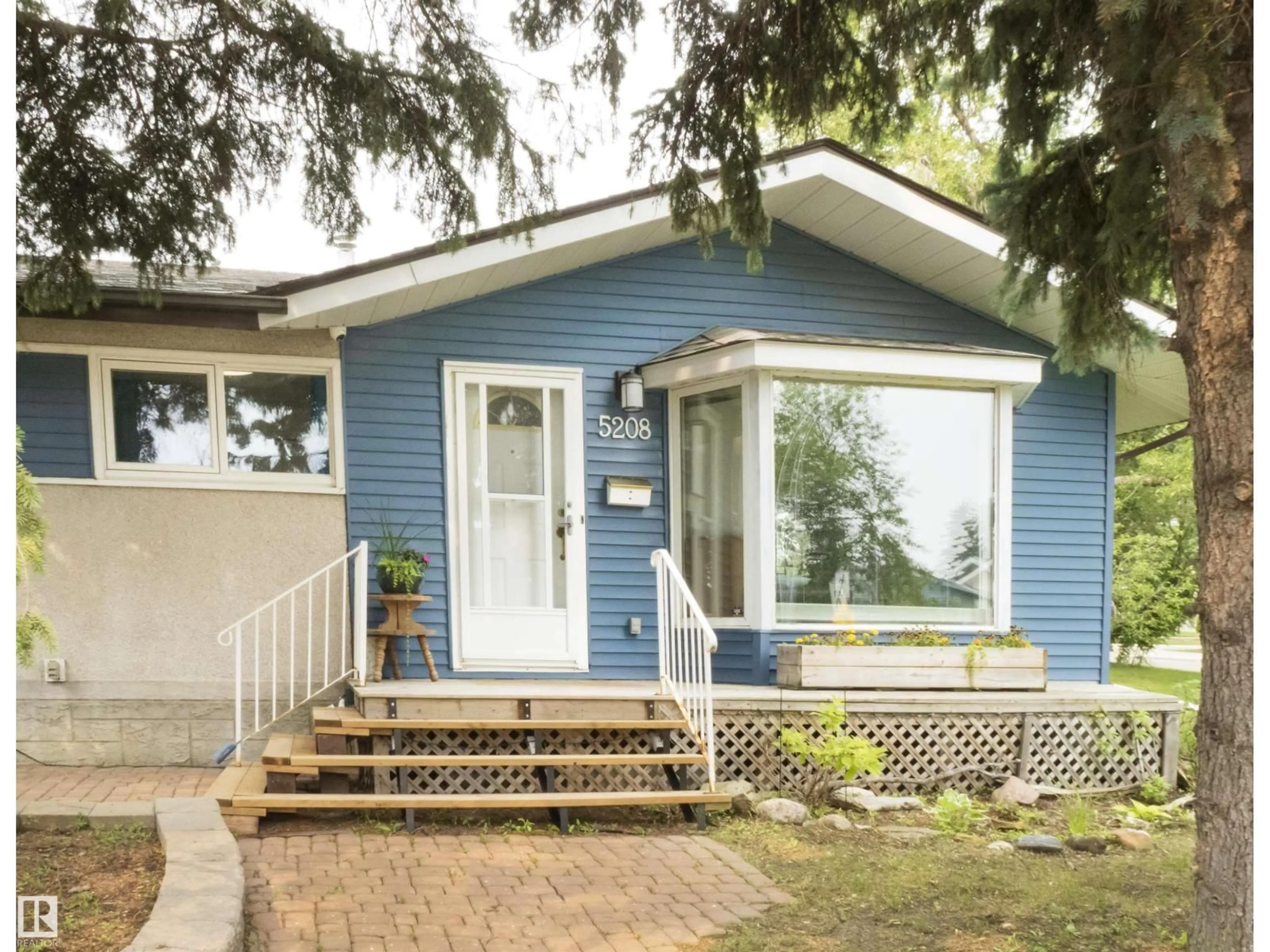 Home with vinyl exterior material, street for 5208 105 ST, Edmonton Alberta T6H2M8