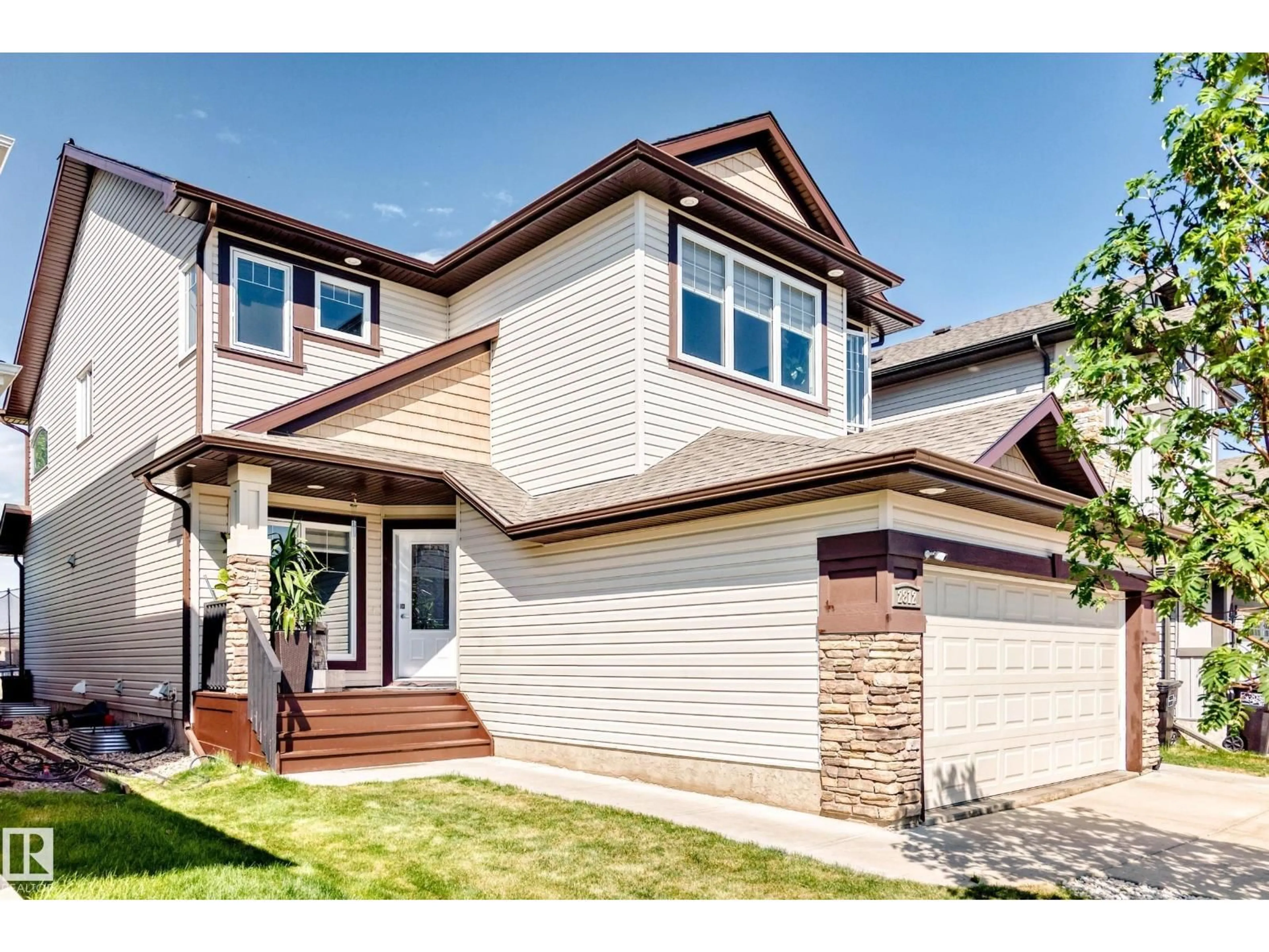 Home with vinyl exterior material, street for 2812 12 ST, Edmonton Alberta T6T0V8