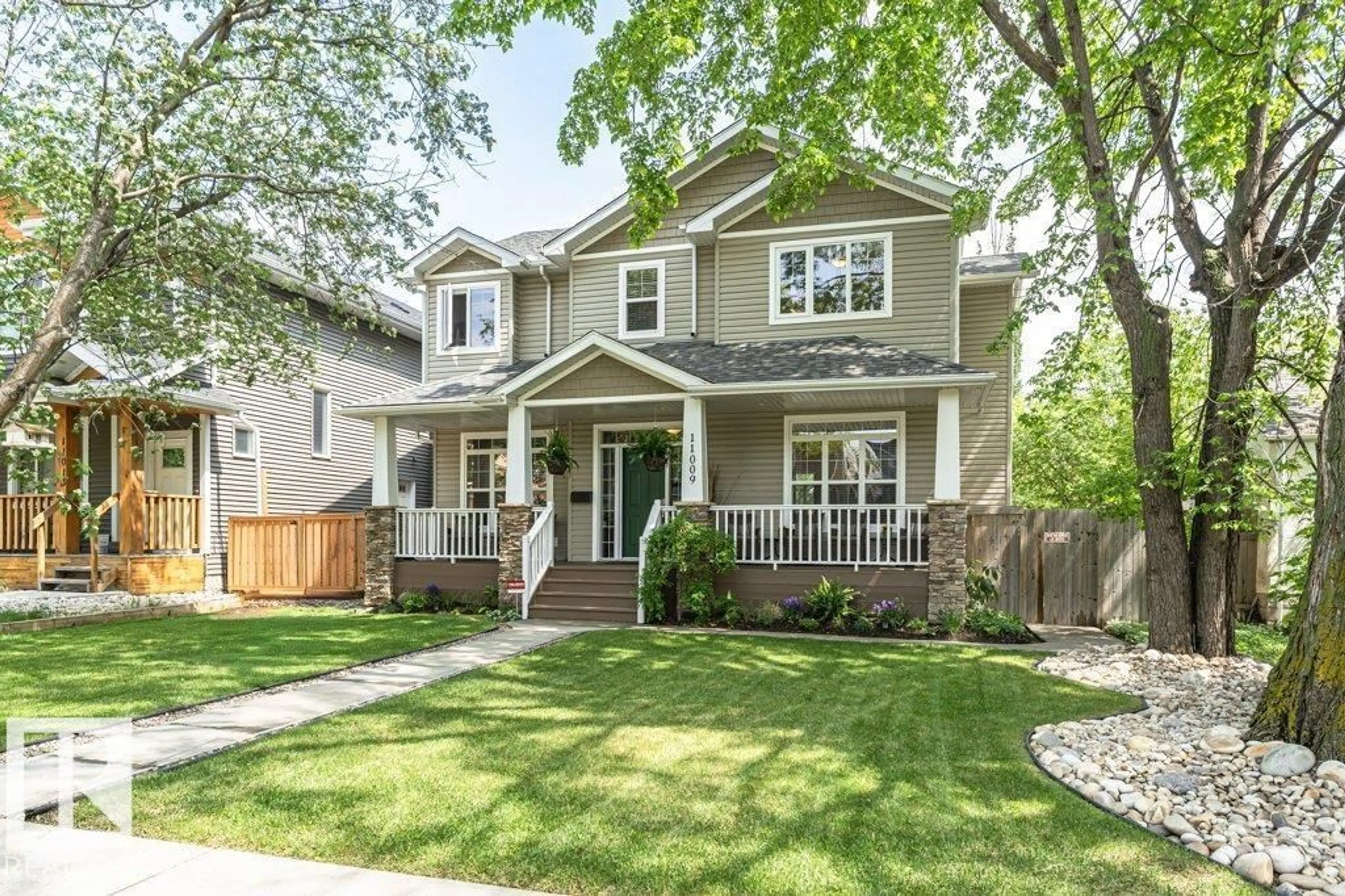 Home with vinyl exterior material, street for NW - 11009 131 ST, Edmonton Alberta T5M1B9