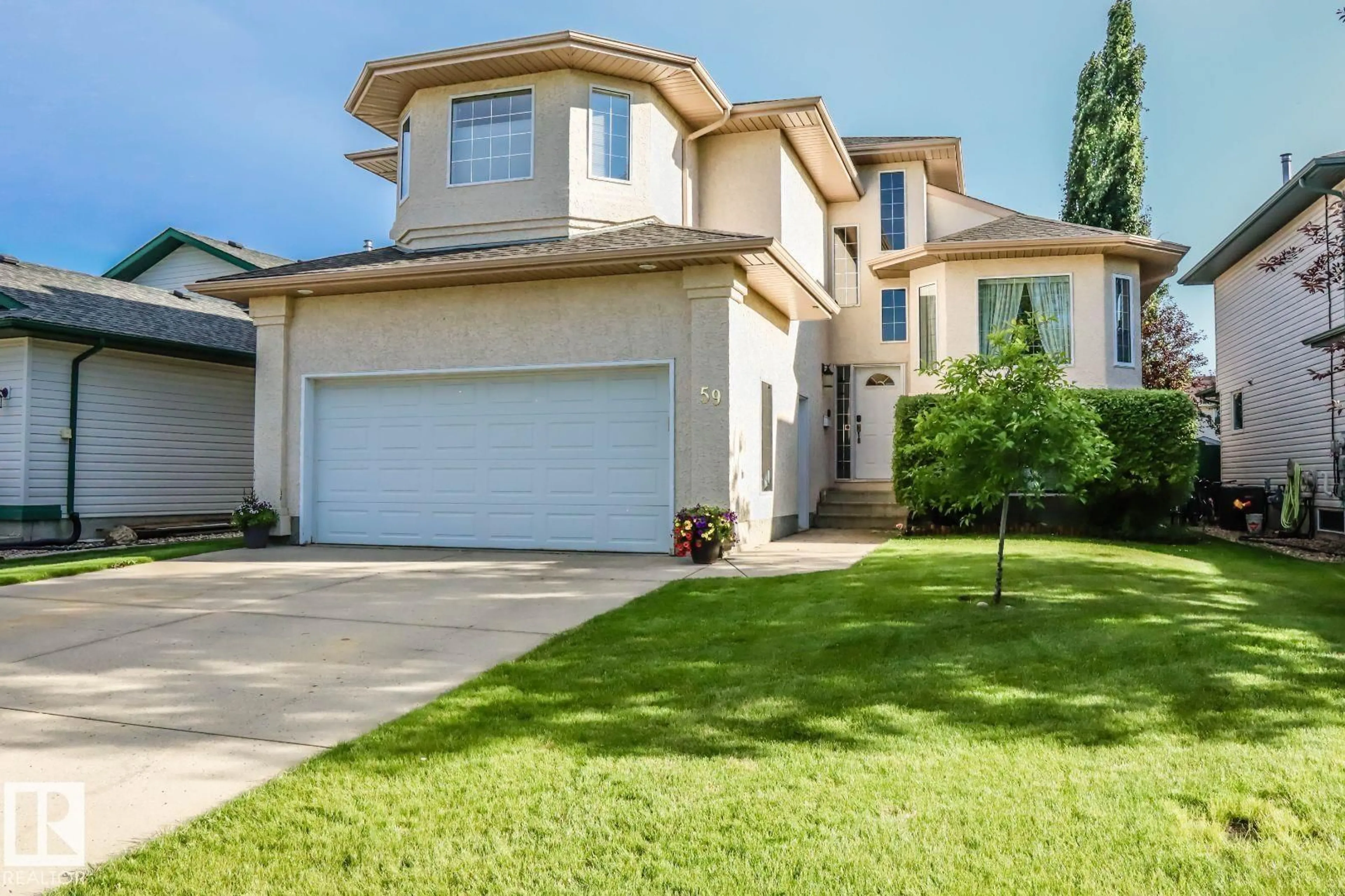 Home with vinyl exterior material, street for 59 BRIDGEPORT WD, Leduc Alberta T9E8B2