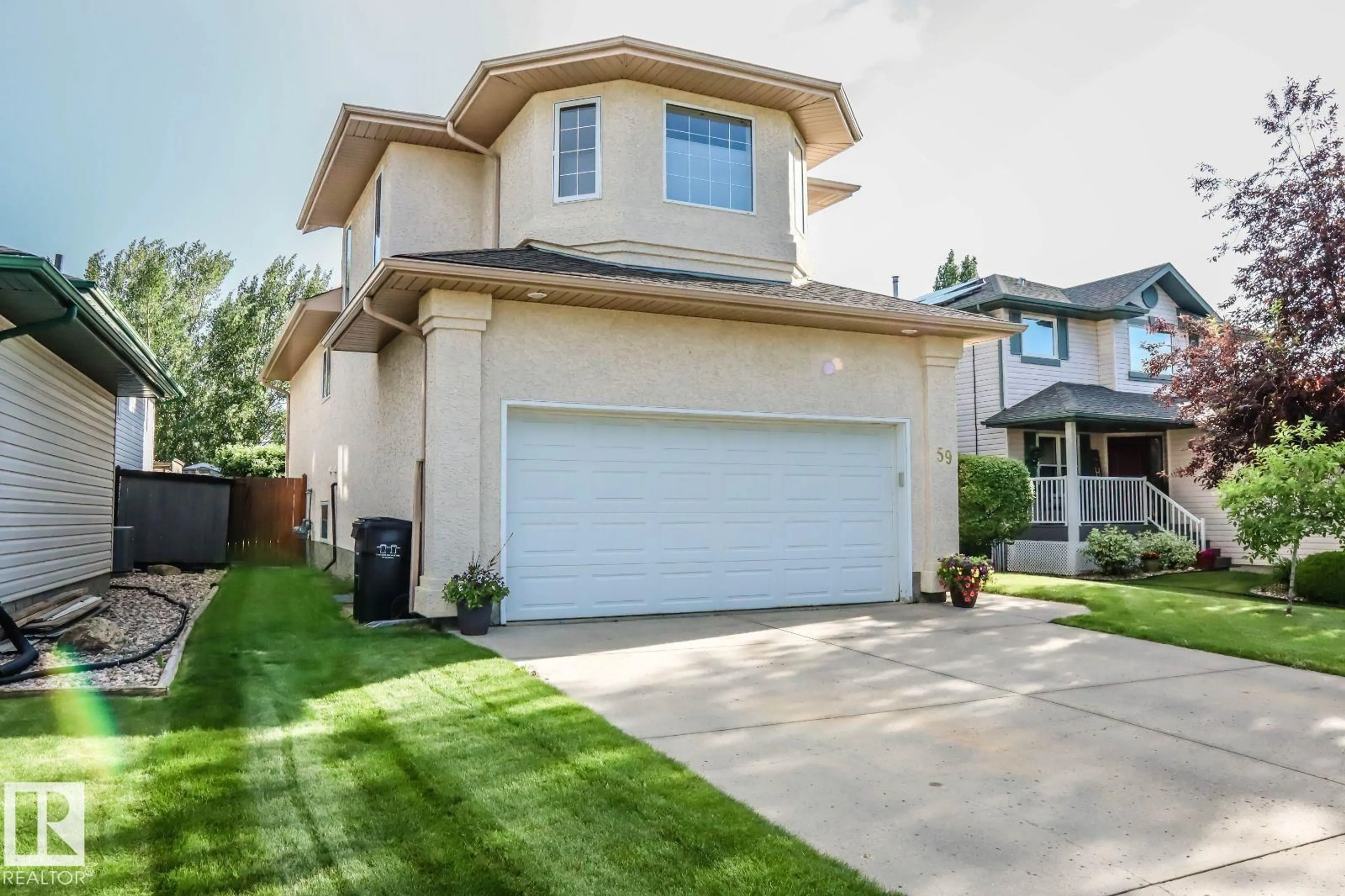 Home with vinyl exterior material, street for 59 BRIDGEPORT WD, Leduc Alberta T9E8B2