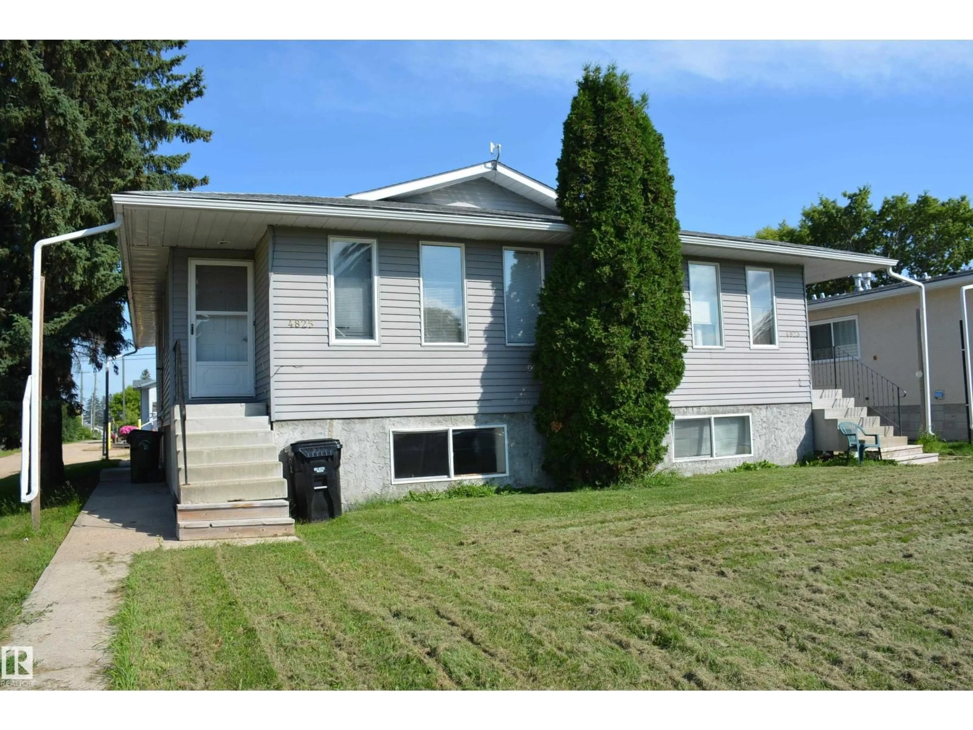 Home with vinyl exterior material, street for 4823 & 4825 52 ST, Barrhead Alberta T7N1G3