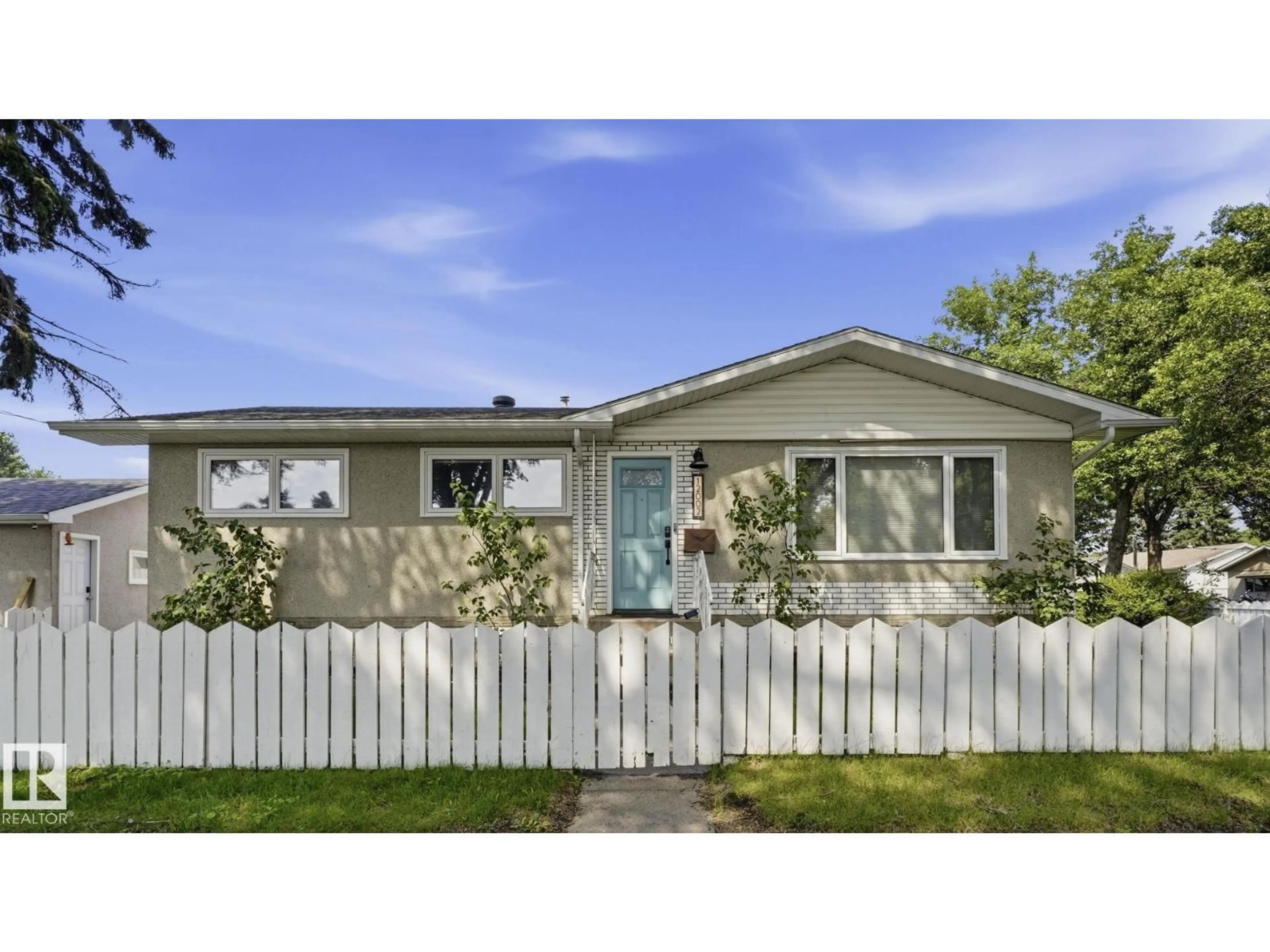 Home with vinyl exterior material, street for NW - 12002 39 ST, Edmonton Alberta T5W2J8