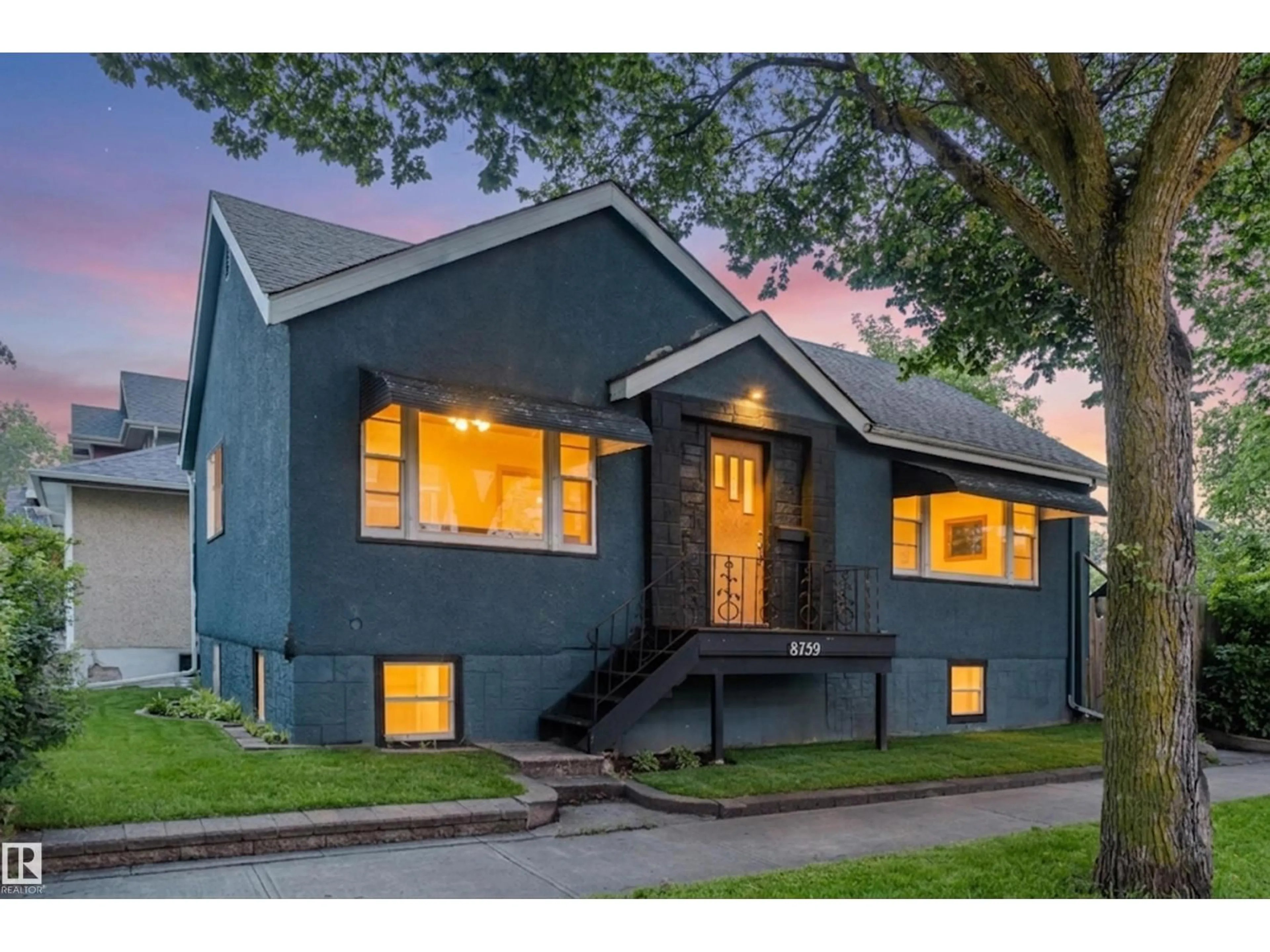 Home with vinyl exterior material, street for NW - 8759 78 AV, Edmonton Alberta T6C0N5
