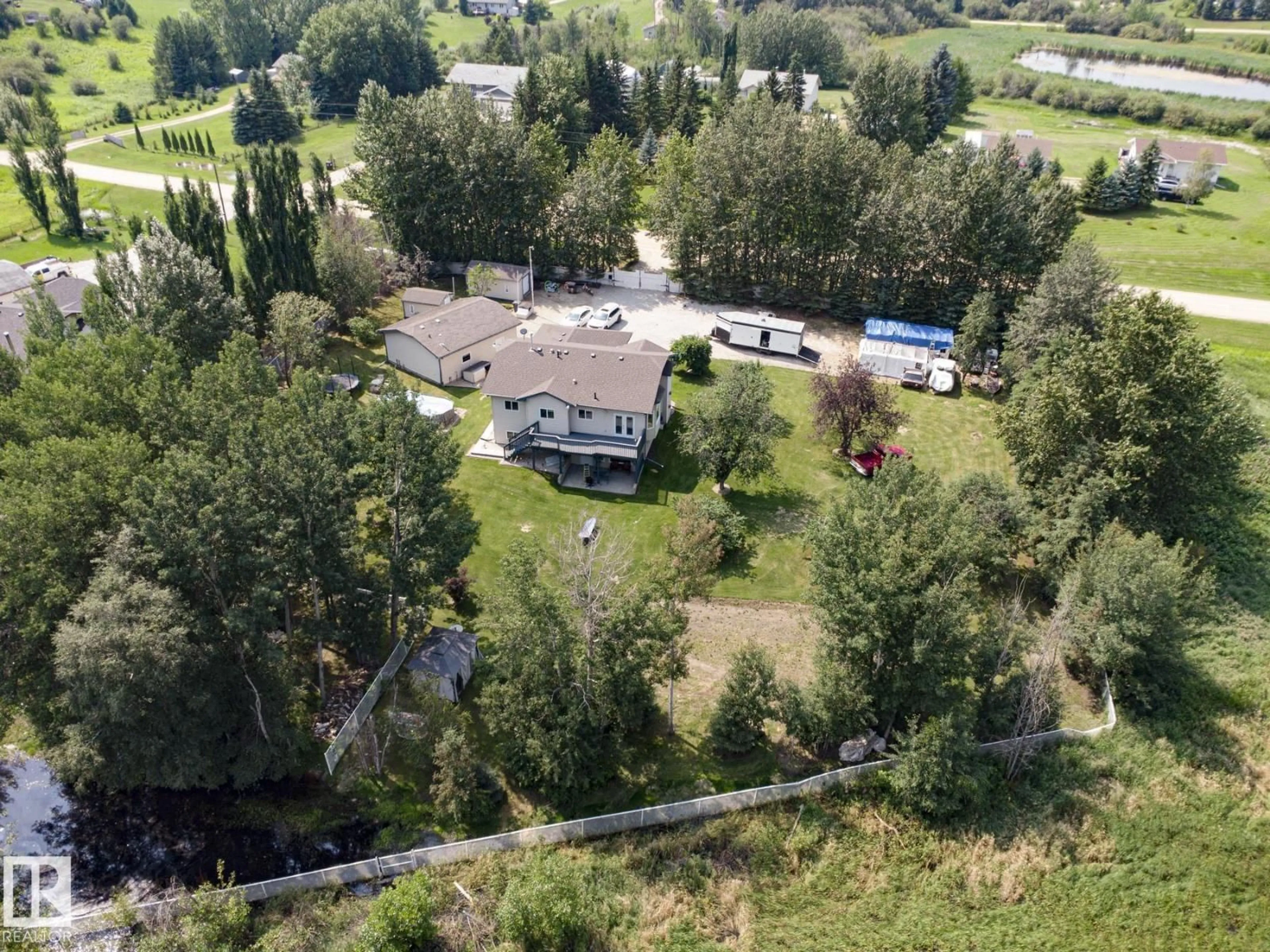 A pic from outside/outdoor area/front of a property/back of a property/a pic from drone, unknown for 61 52318 RGE ROAD 25, Rural Parkland County Alberta T7Y2M3